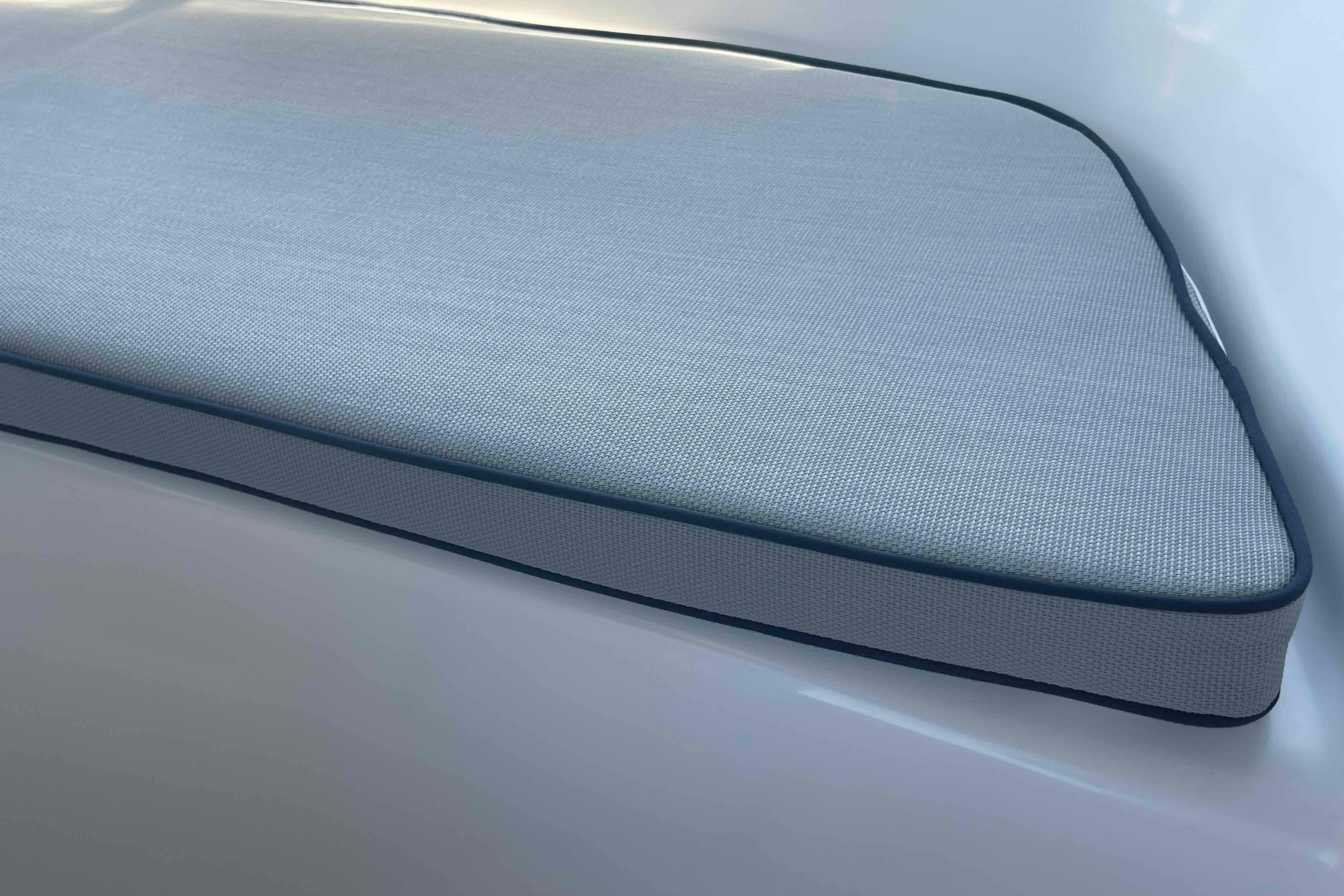 Cushioned seat on 2004 Hunter 36 boat, featuring sleek design and durable fabric.