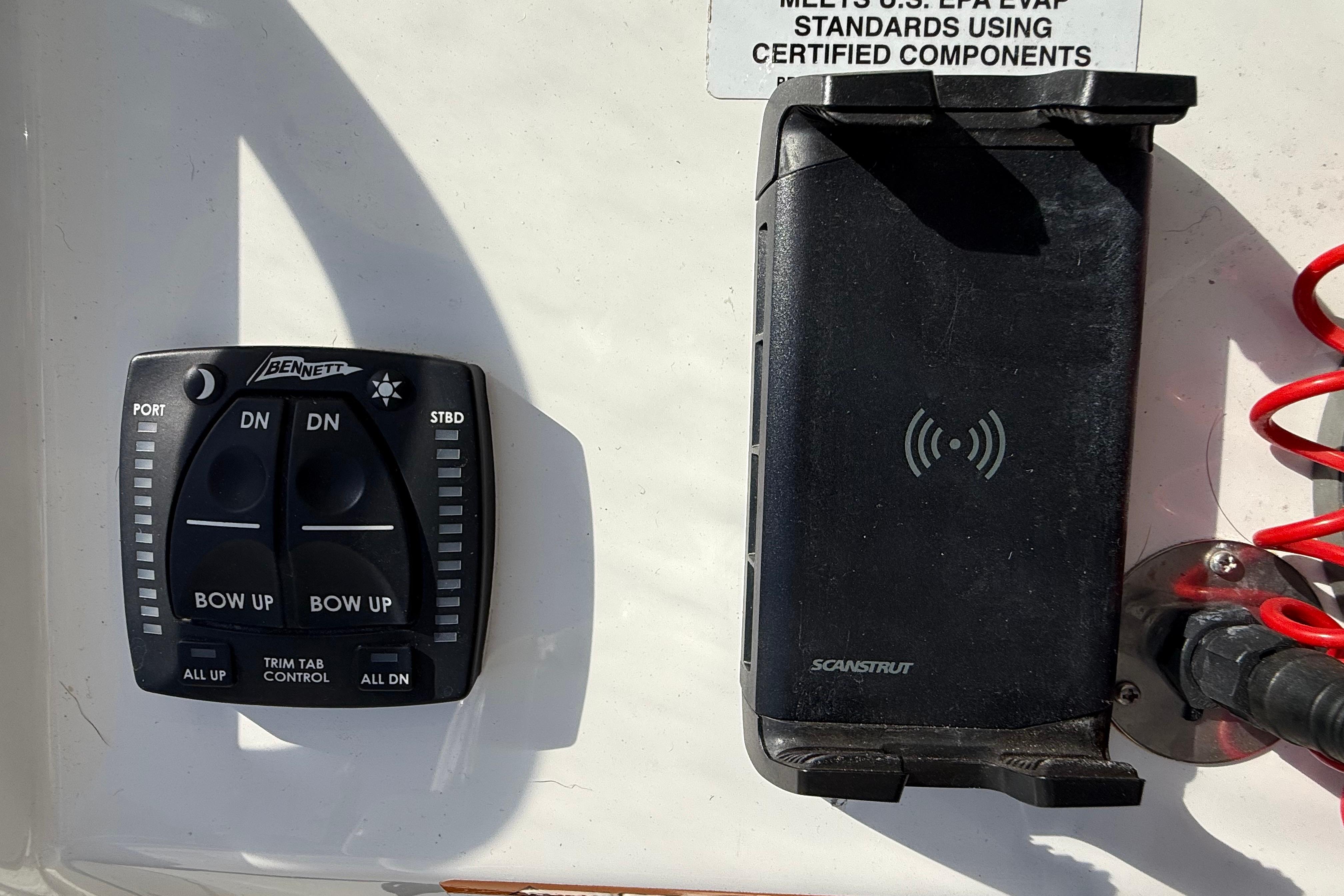 Control panel and phone holder on 2022 Regulator 34 boat dashboard.