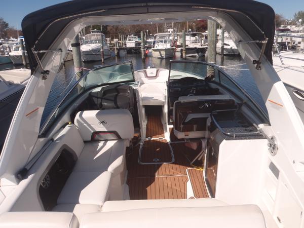 2015 Monterey 288 Super Sport boat interior at marina, featuring spacious seating and sleek design.