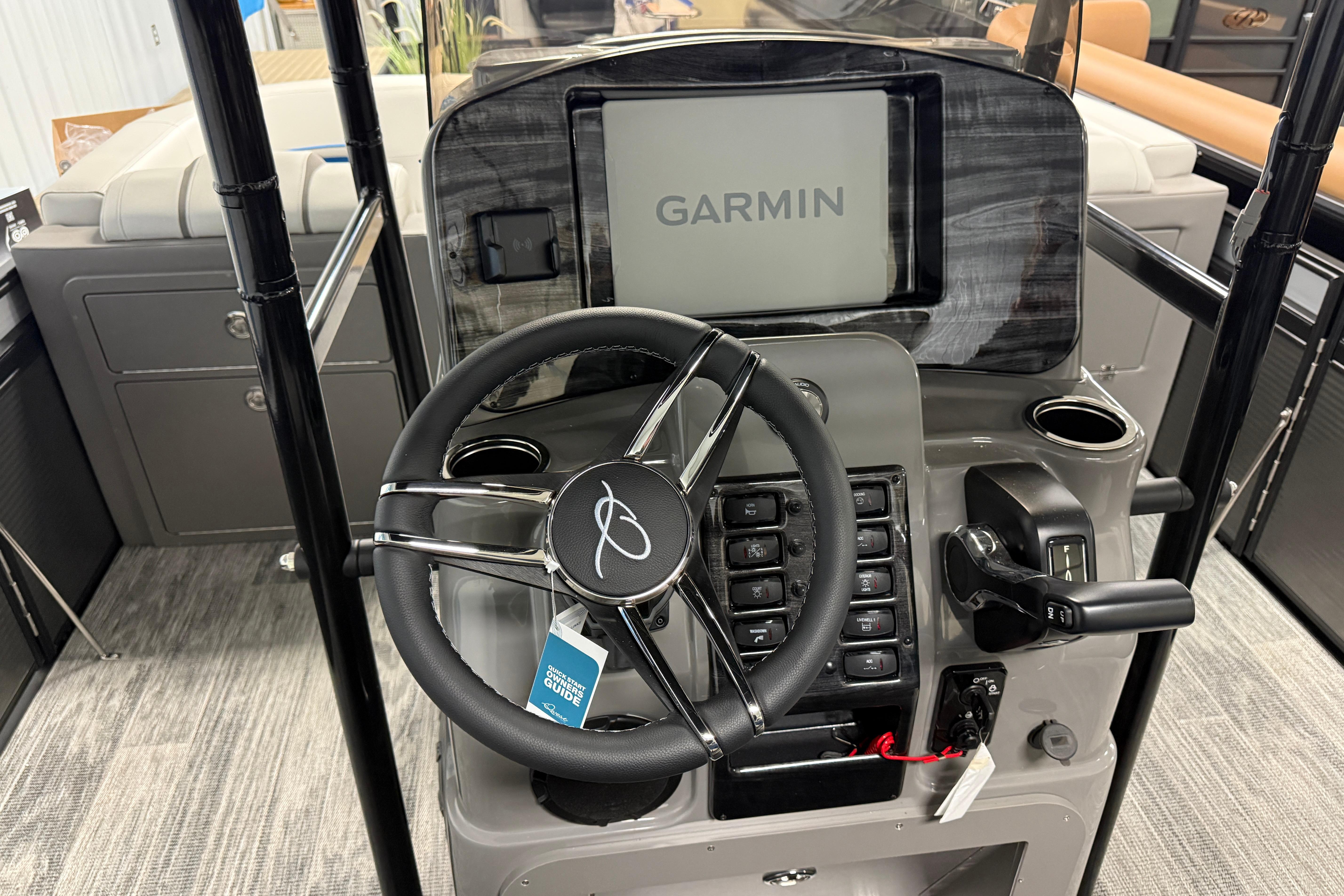 2026 Qwest M-Class 22 Pro Sport boat dashboard with Garmin navigation system.