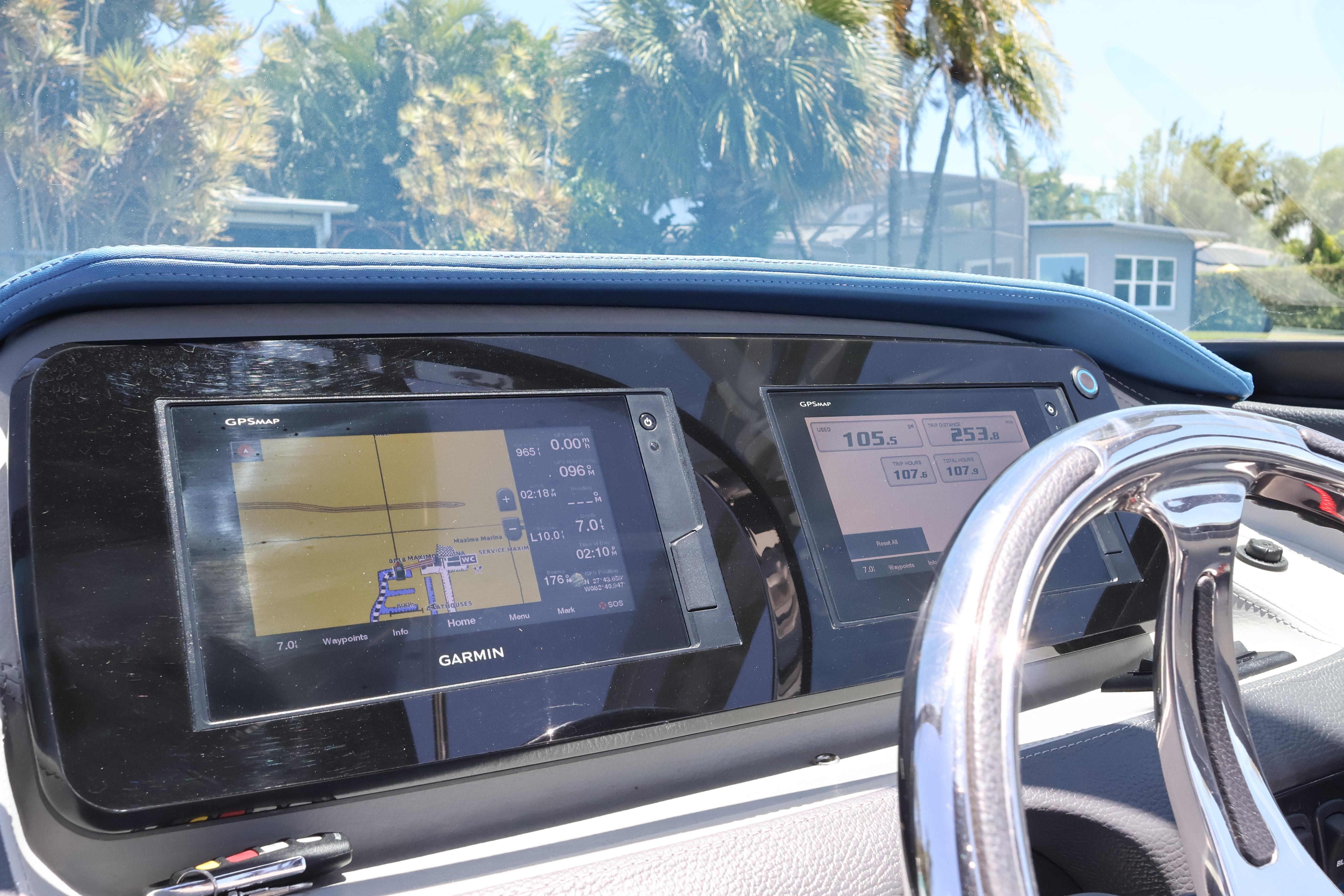 2020 Regal LX4 dashboard with Garmin GPS displays and chrome steering wheel.