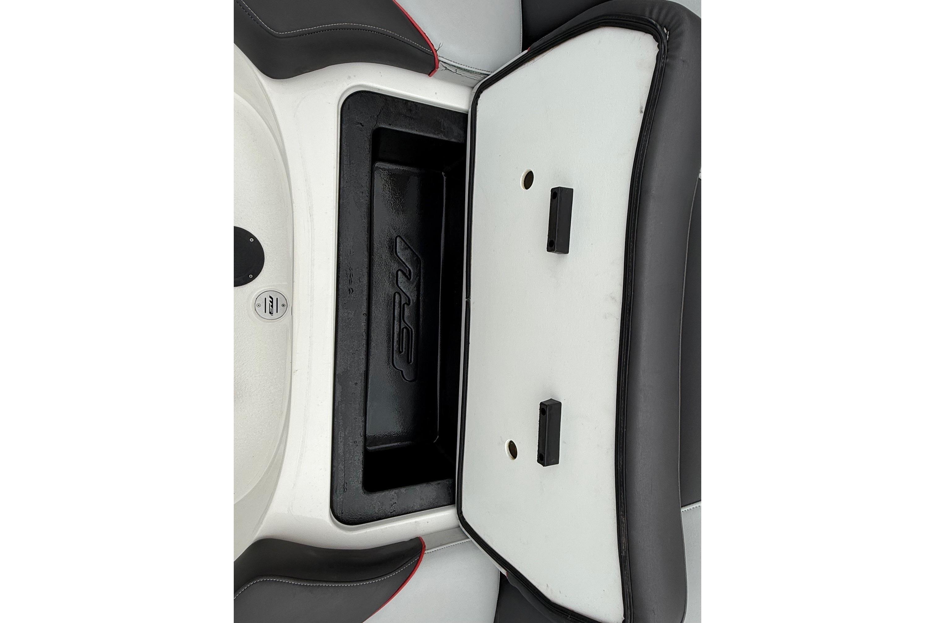 2014 MBSPORTS B523 23V boat storage compartment with open lid and black interior.