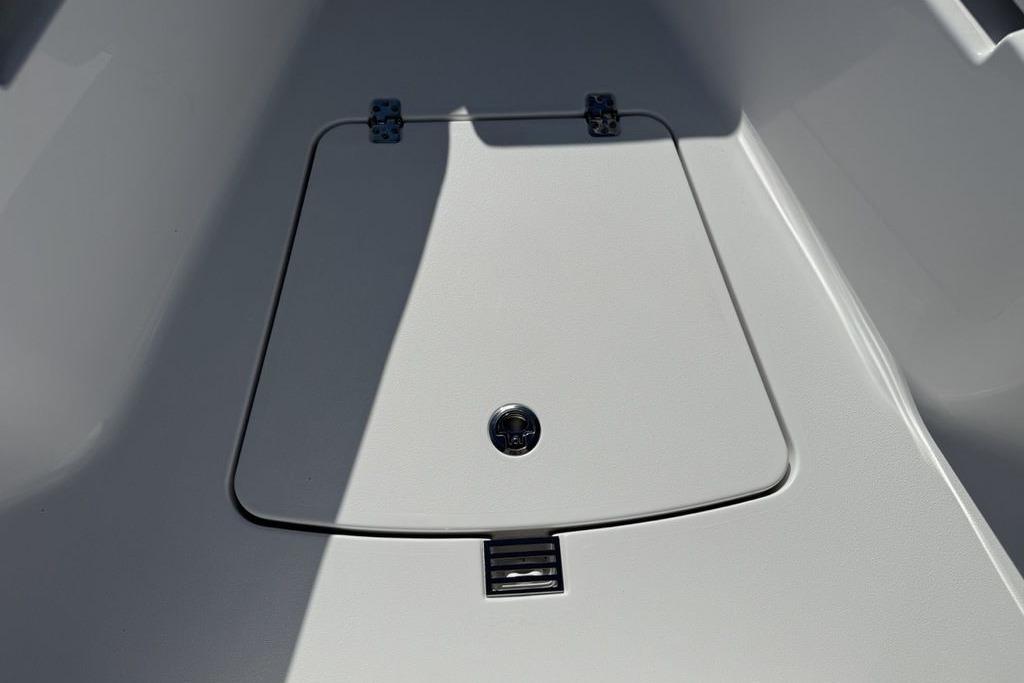2026 Sportsman Open 232 Center Console boat storage compartment detail.