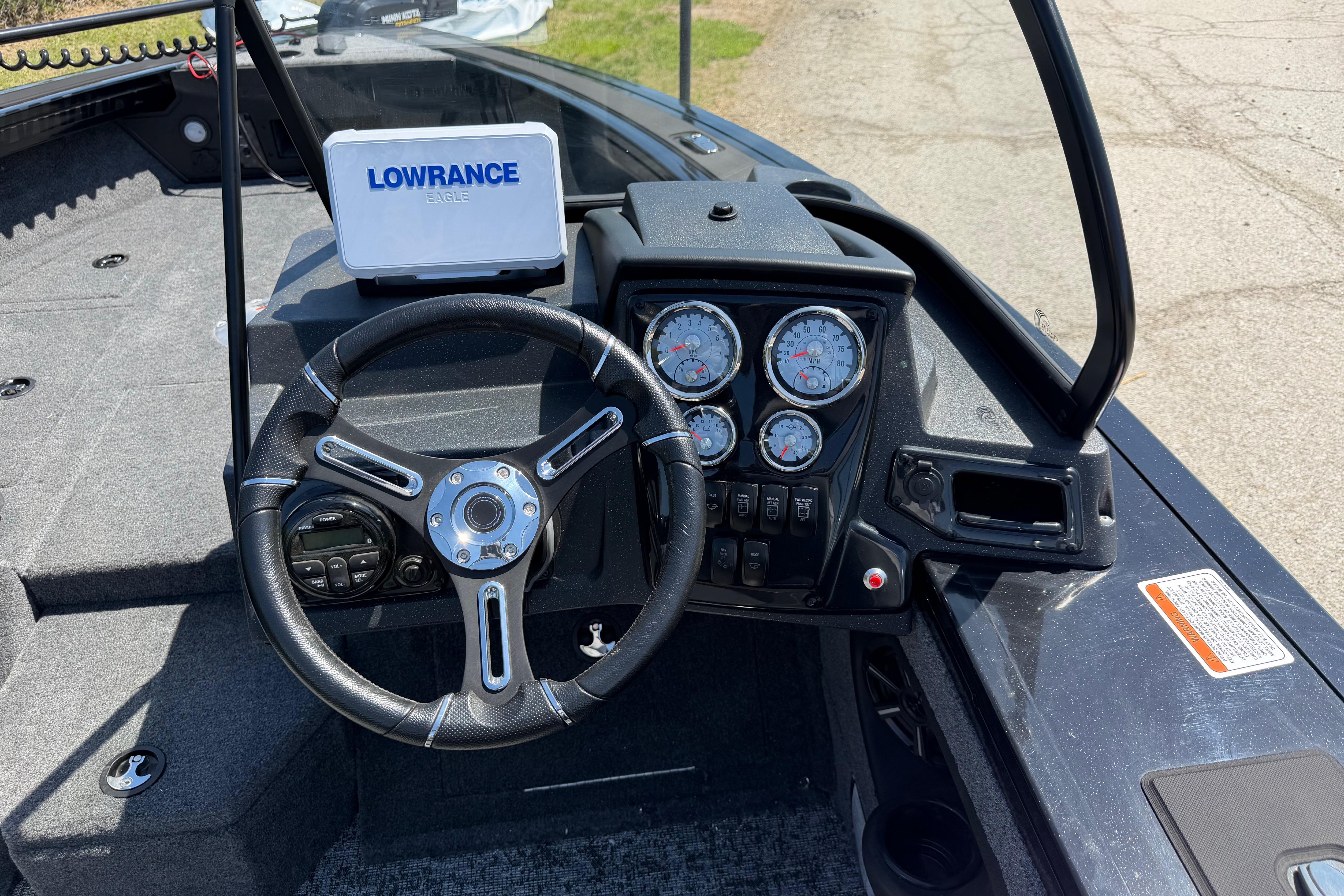 Steering console of 2026 Tracker Targa V-19 WT boat with Lowrance electronics.