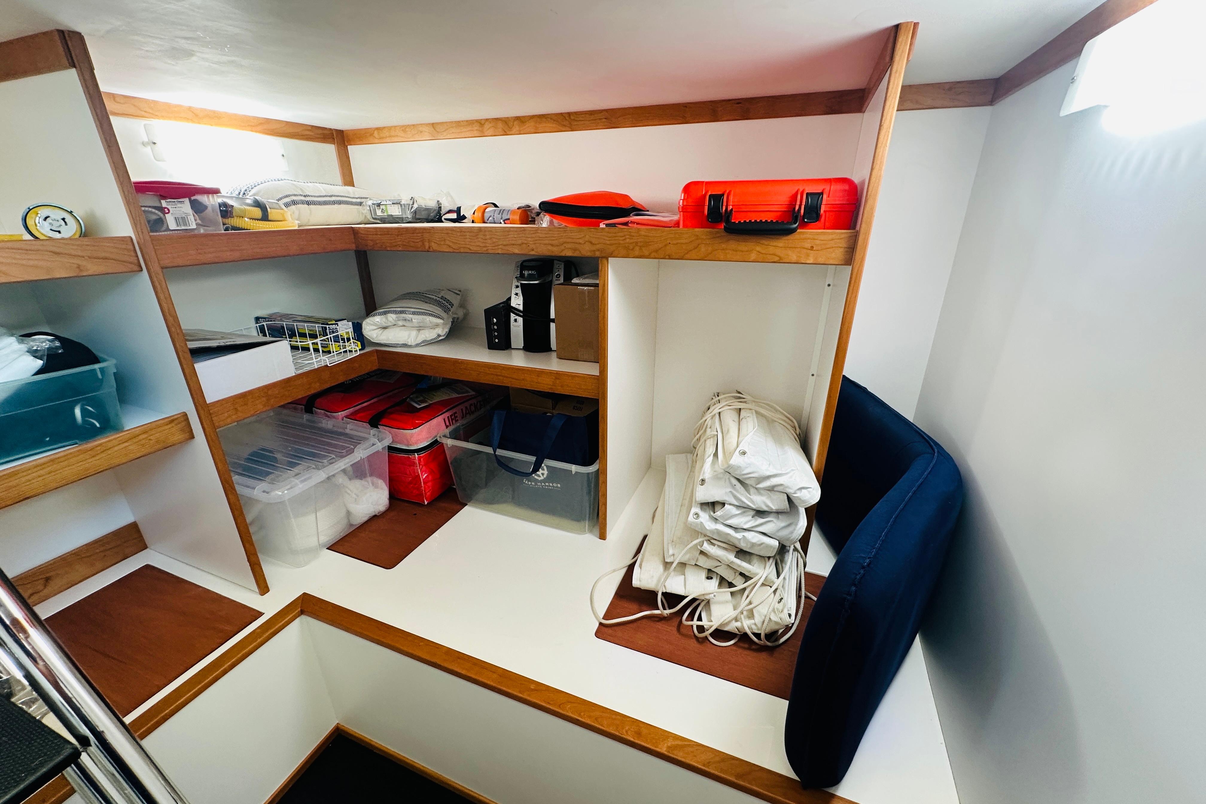 Storage area in 2025 Sabre 48 Salon Express yacht with organized shelves and equipment.