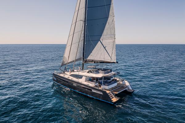 Luxury Privilege Signature 650 catamaran sailing on open sea, 2025 model.