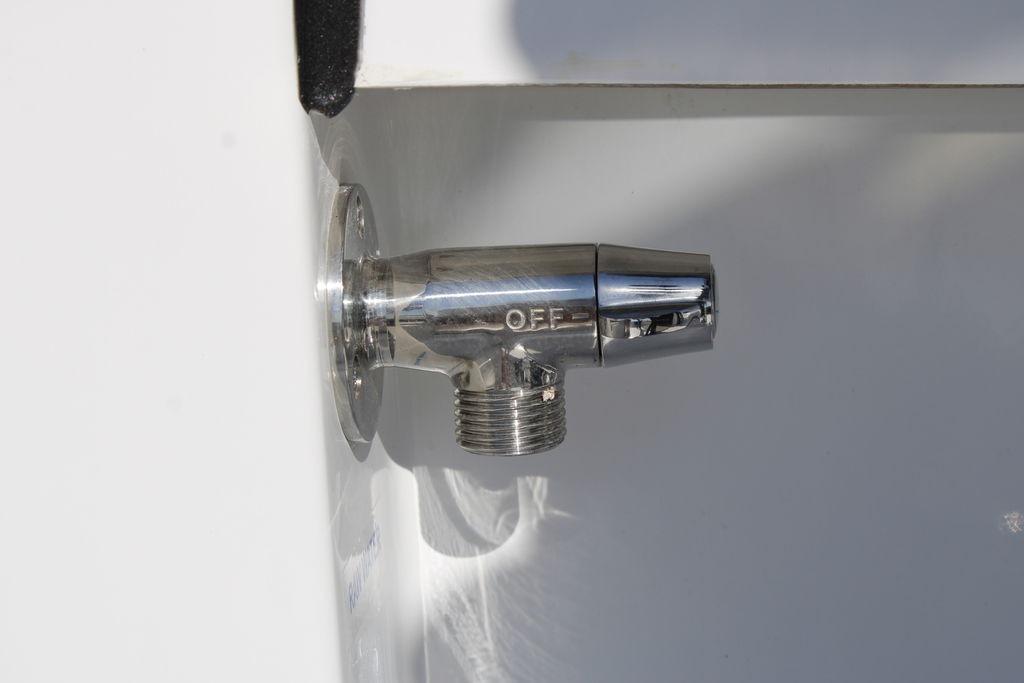 Chrome valve on 2026 Tidewater 2110 Bay Max boat, marked "OFF."