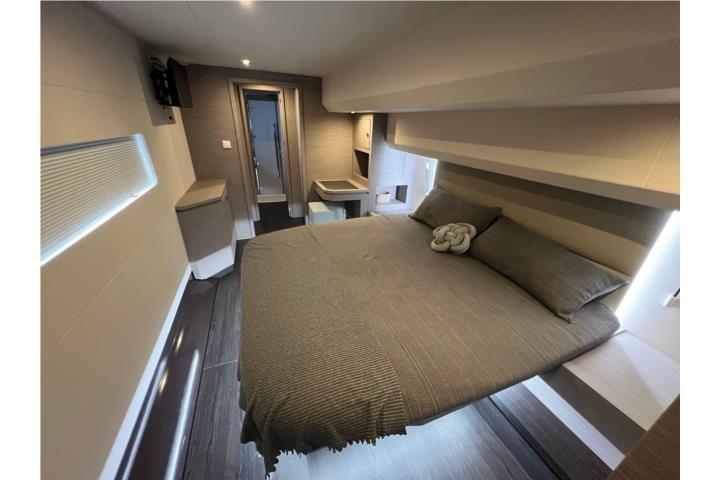Luxurious bedroom interior of 2024 Fountaine Pajot MY 44 yacht, featuring modern design and cozy bedding.