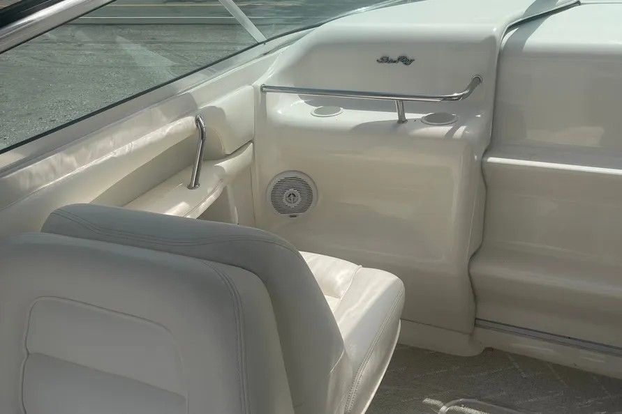 Interior of a 1996 Sea Ray Sun Sport boat with white seating.