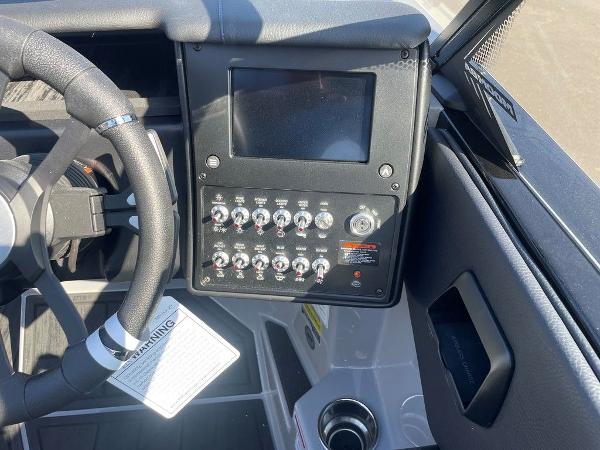2025 Moomba Mondo boat dashboard with steering wheel and control panel.
