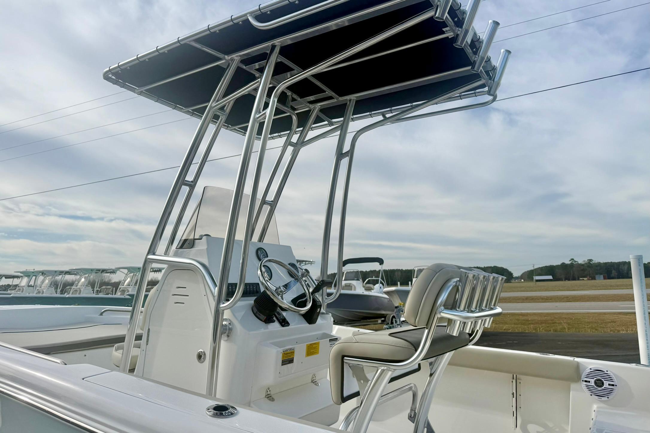 2026 Key West 189 FS boat with T-top and helm, parked outdoors.