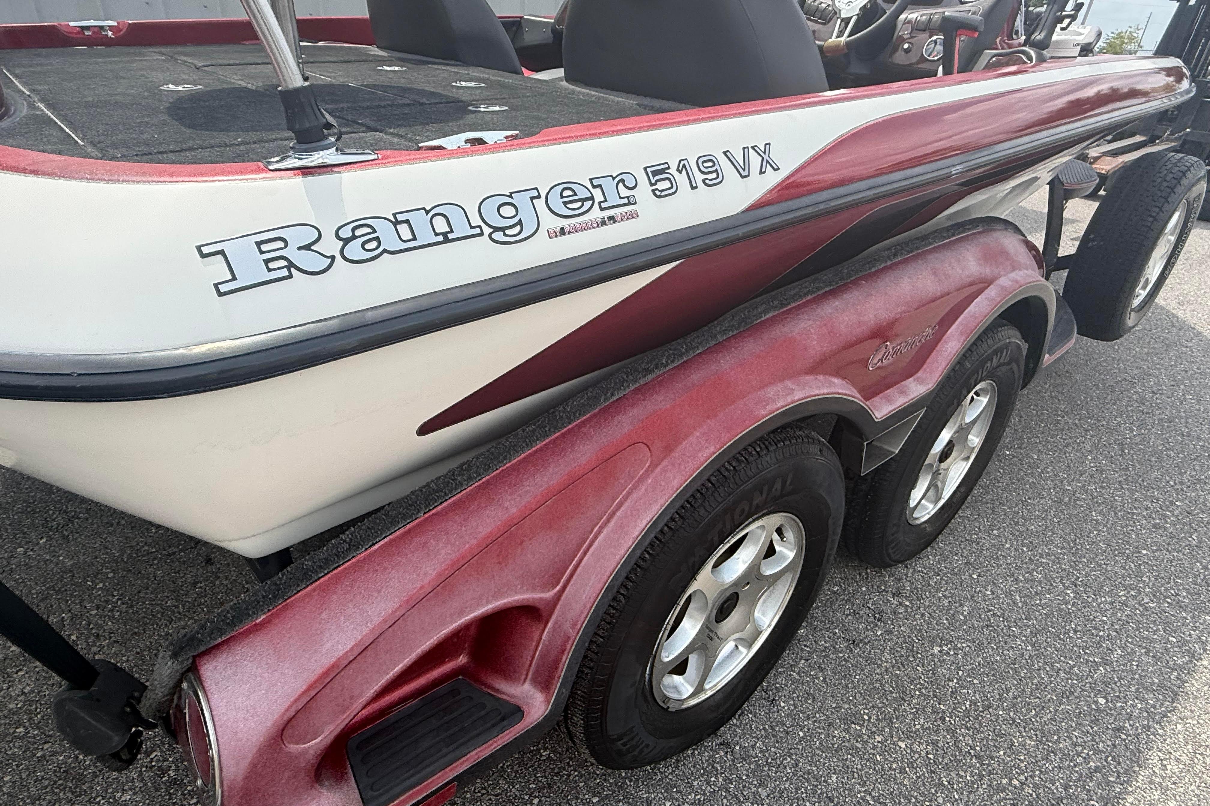 2007 Ranger 519 VX boat on trailer, featuring red and white design.
