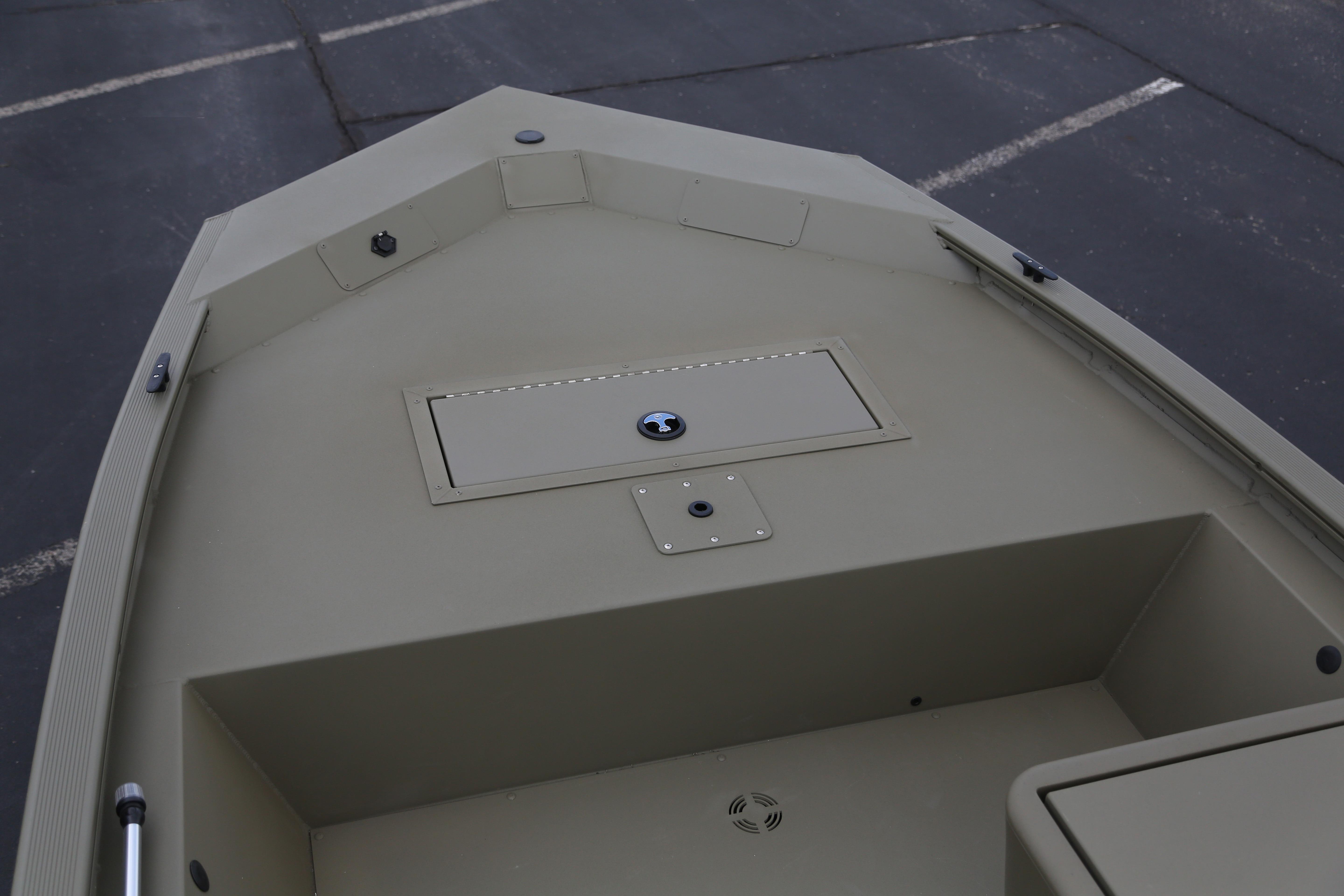 2026 Tracker Grizzly 1648 SC boat interior with storage compartment, viewed from above.
