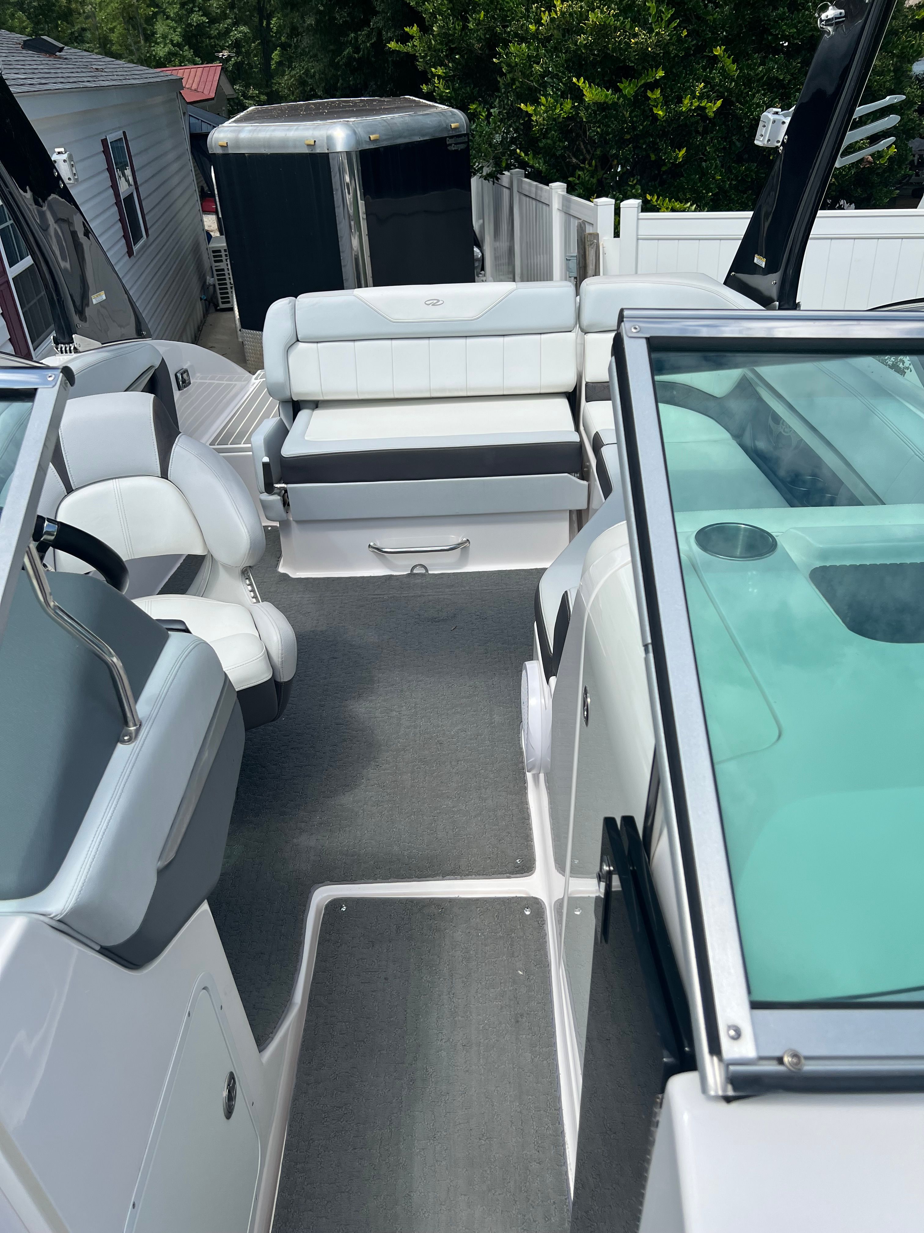Interior of a 2014 Regal 24 FasDeck RX boat with white seating.