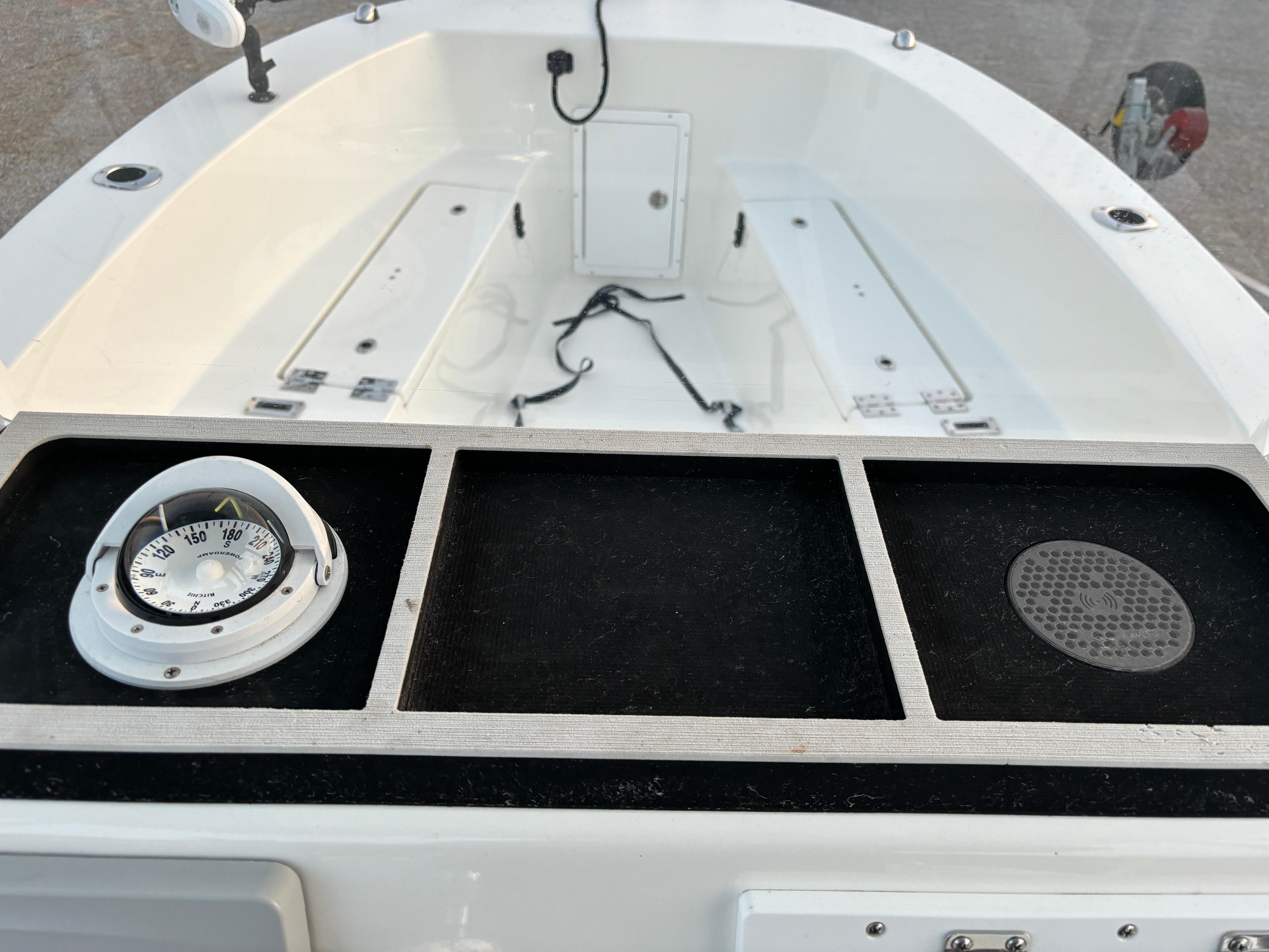 KenCraft 21 boat interior, 2021 model, featuring a compass and storage compartments.