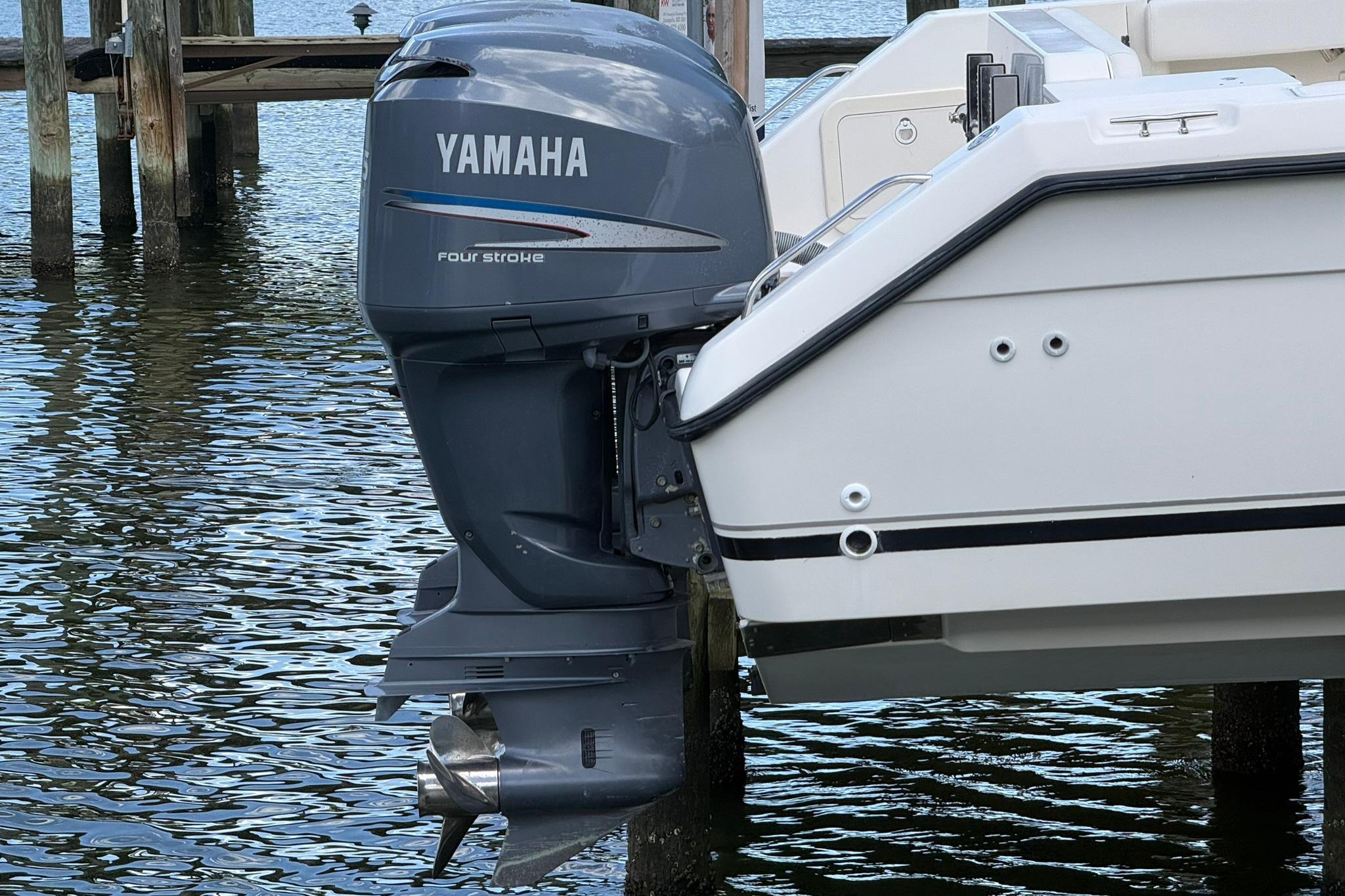 2003 Pursuit 2870 Walkaround with Yamaha four-stroke outboard motor, docked by the water.