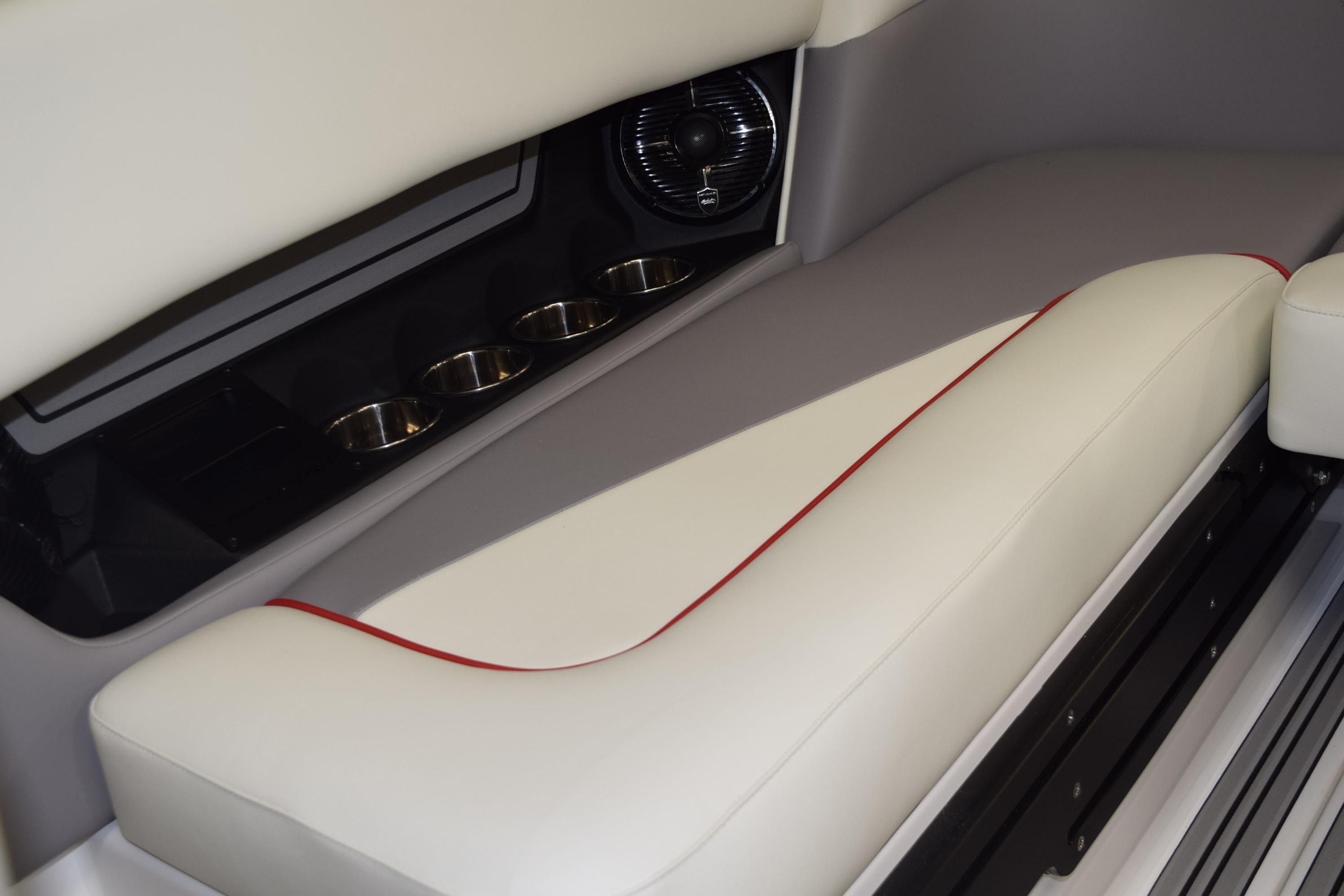 2026 Moomba Craz boat interior with cushioned seating and cup holders.