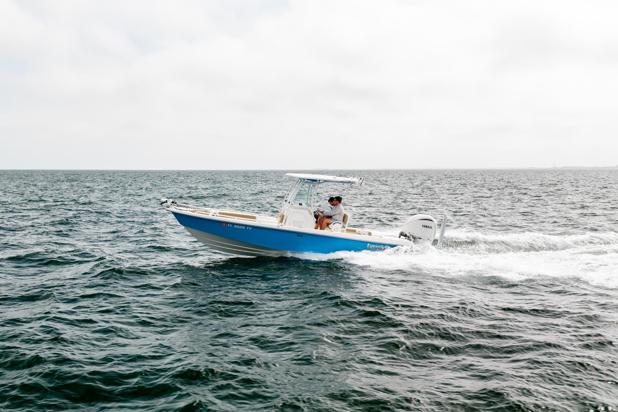 2023 Everglades 243 Center Console boat cruising on open water.