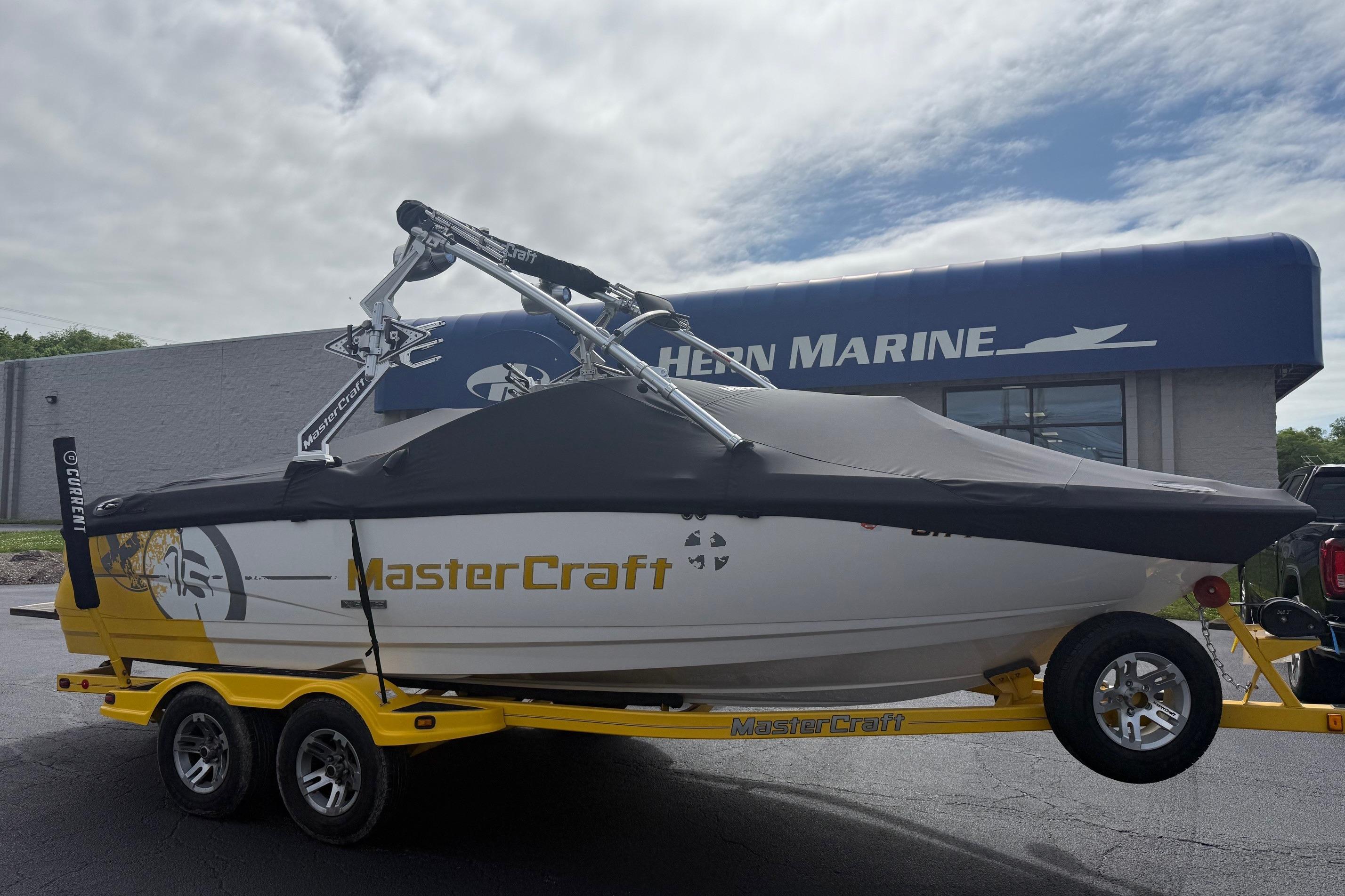 2008 MasterCraft X-15 boat on trailer at Heron Marine dealership.