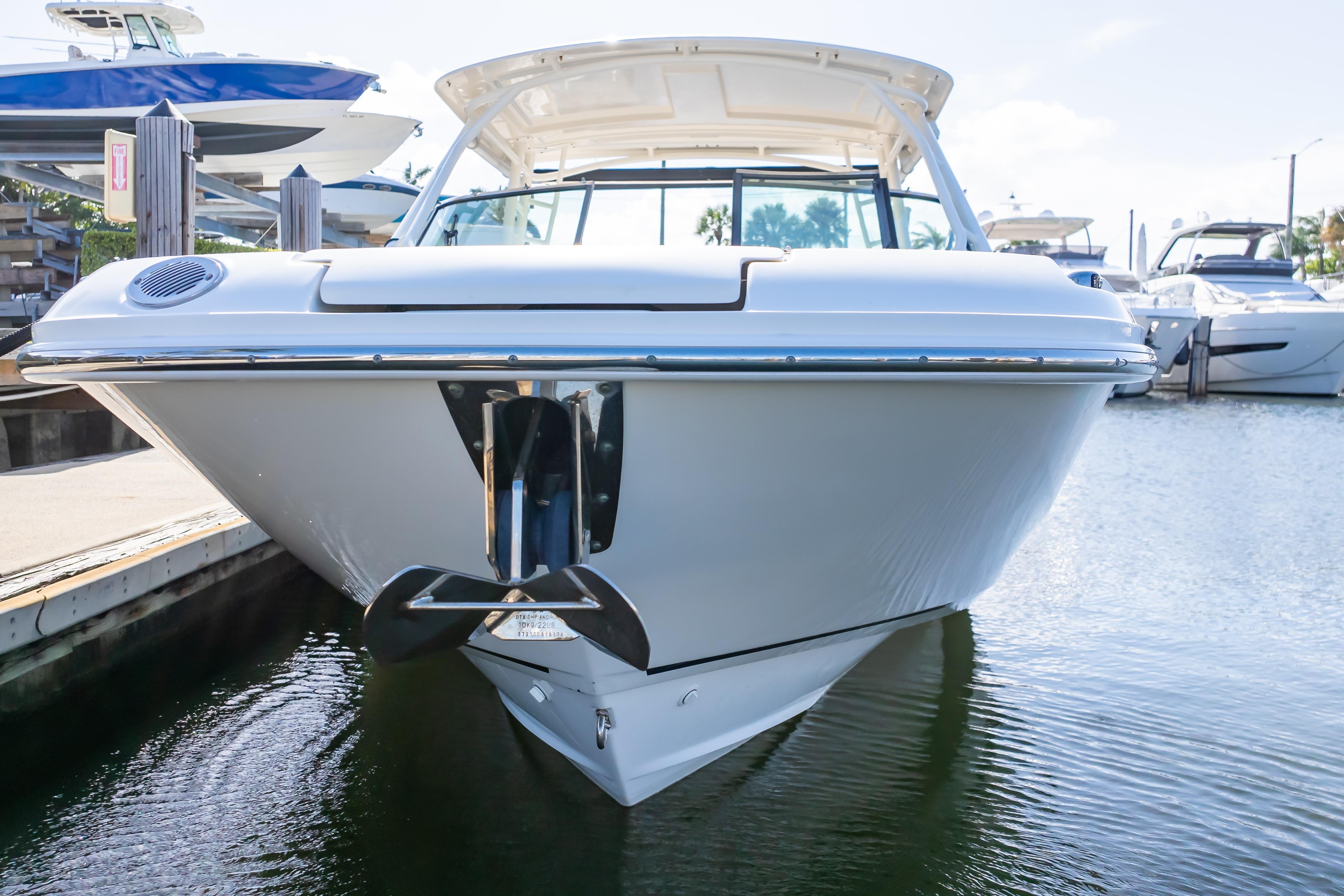 2019 Boston Whaler 270 Vantage boat docked at marina, front view.