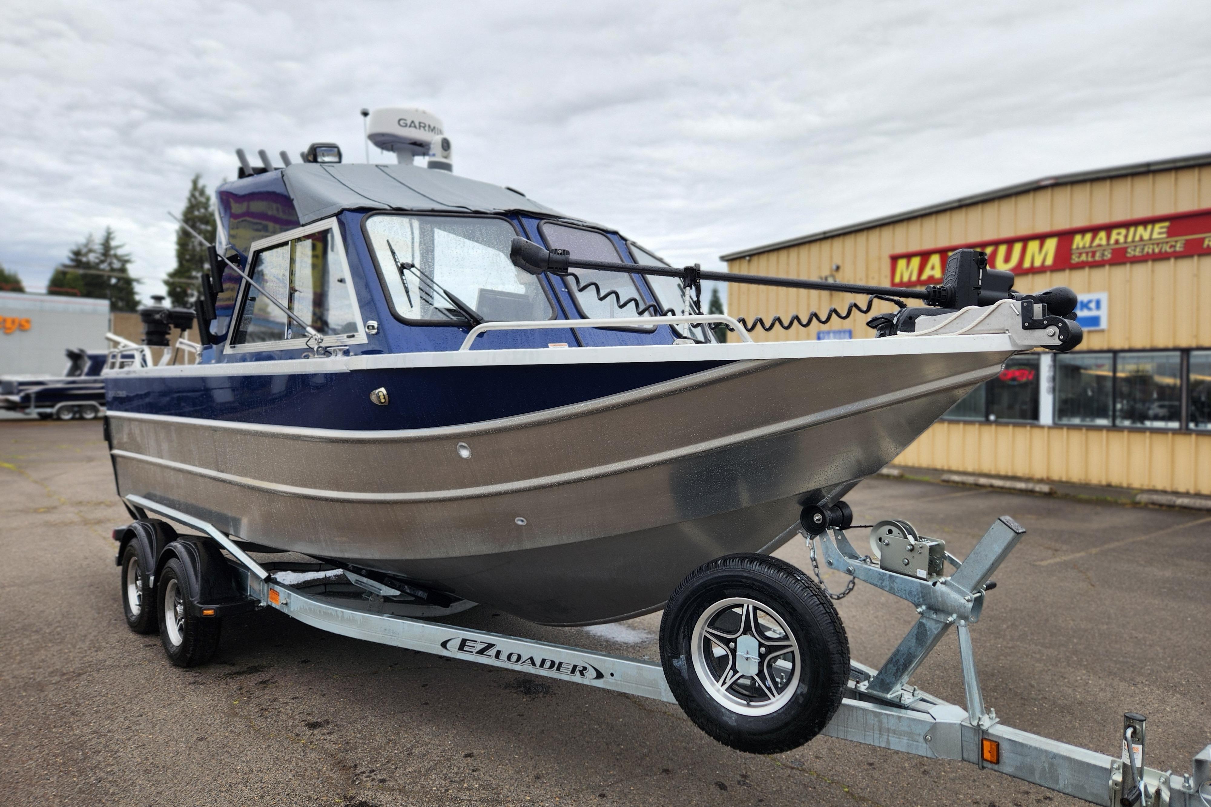 2025 Thunder Jet 21 Chinook OS boat on trailer at dealership.