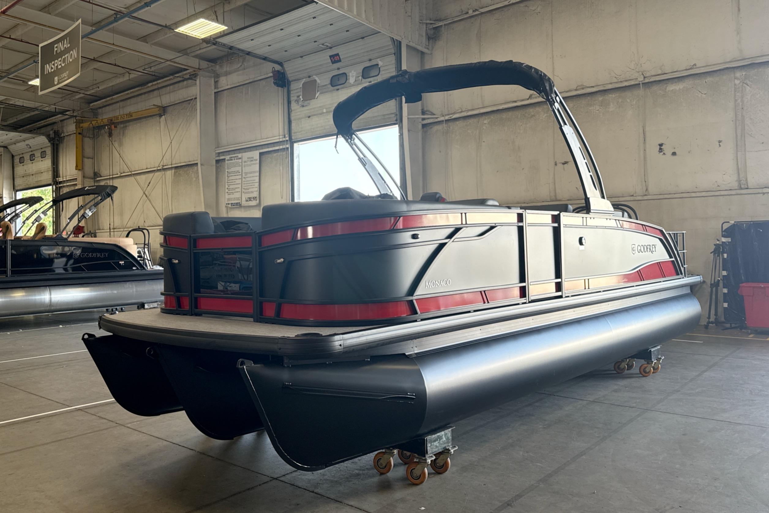 2027 Godfrey Monaco 25' Tritoon in warehouse, final inspection stage.