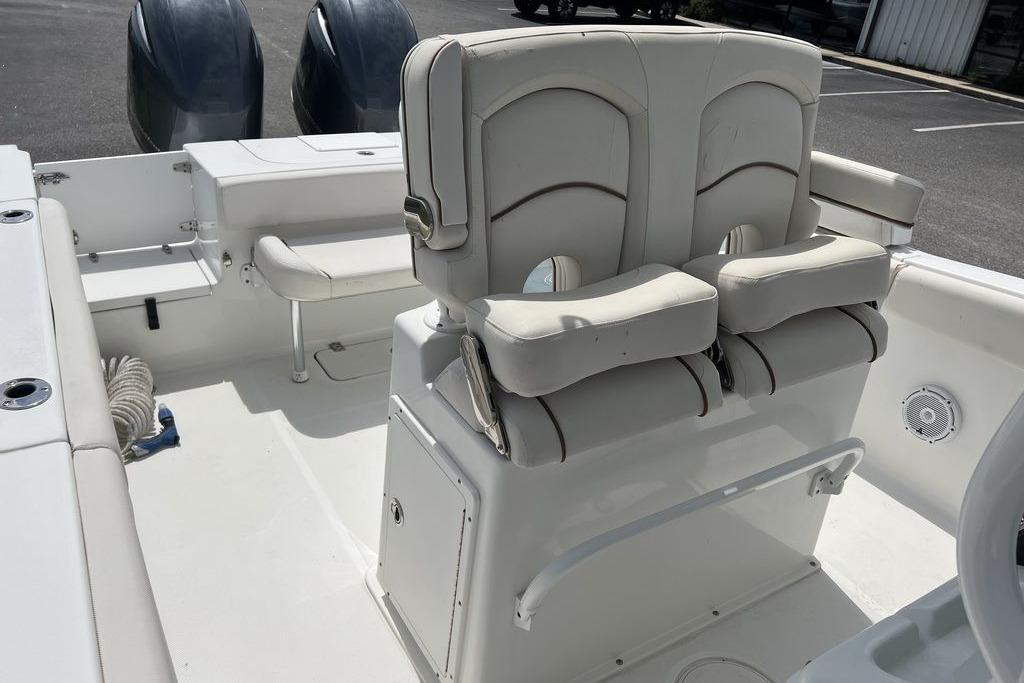 2021 Sea Hunt Gamefish 25 boat interior with dual seats and twin engines.