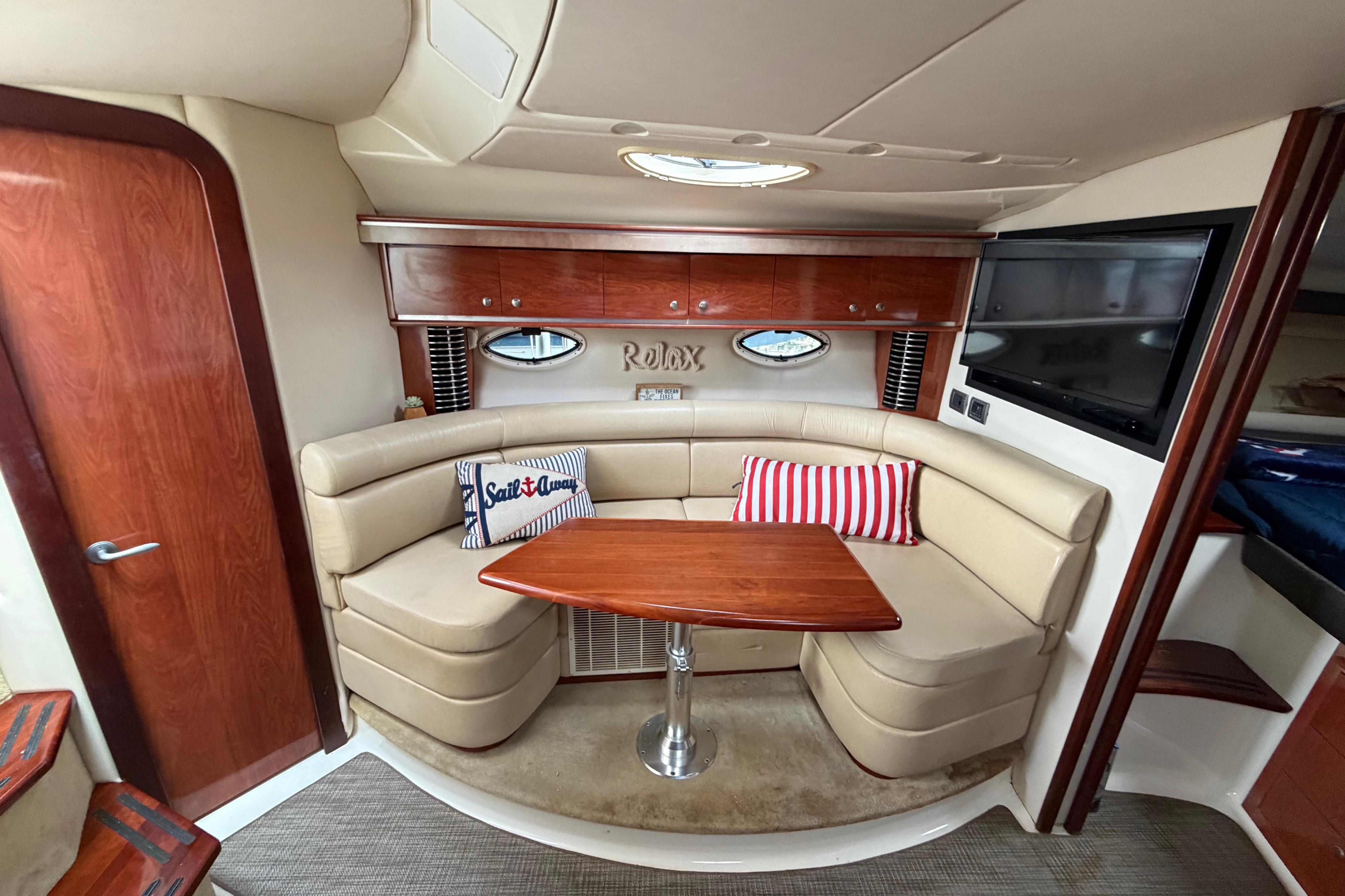Luxurious interior of a 2007 Monterey 350 Sport Yacht with plush seating and elegant wood finishes.