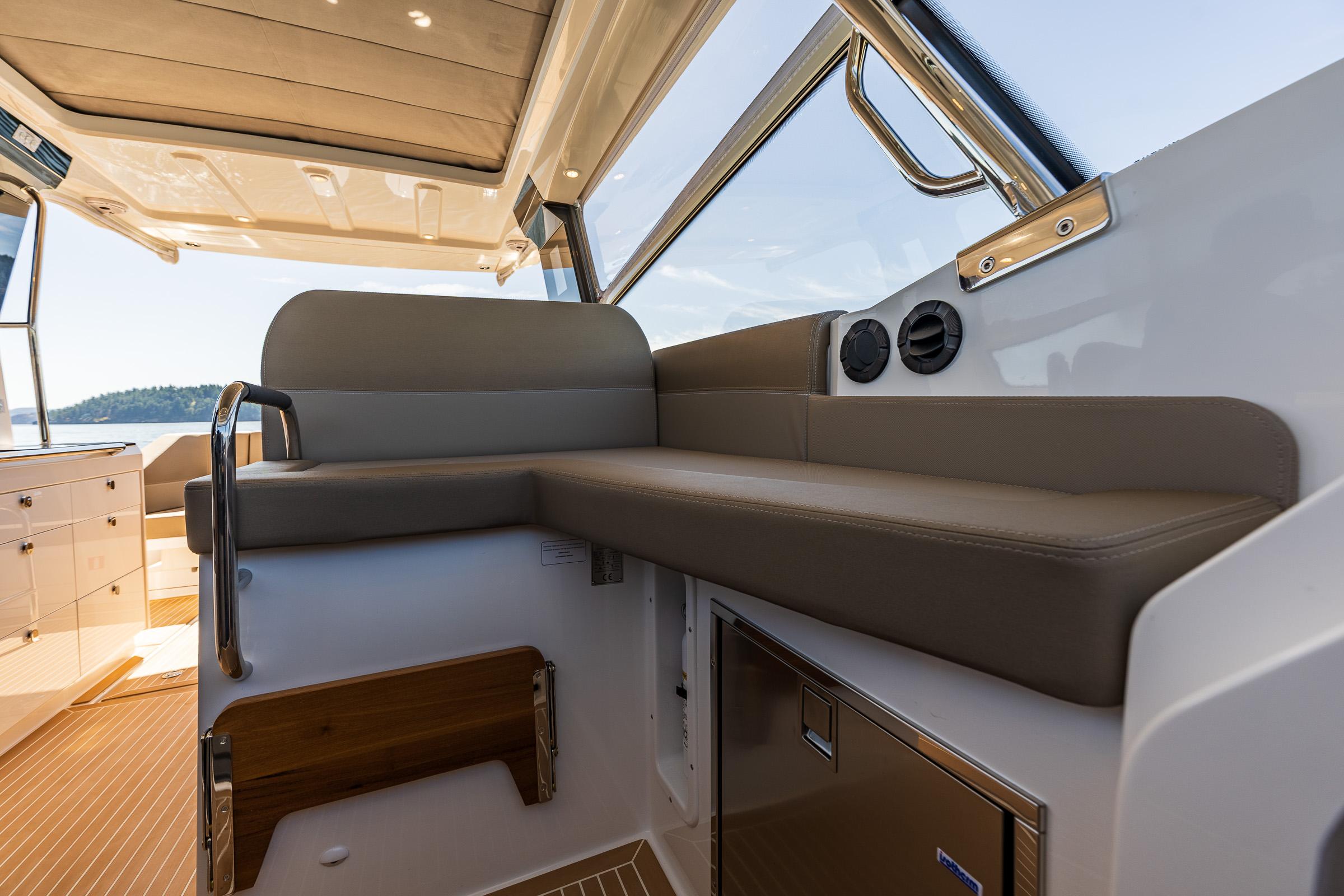 Luxurious interior of 2025 Nimbus W11 boat with comfortable seating and modern design.