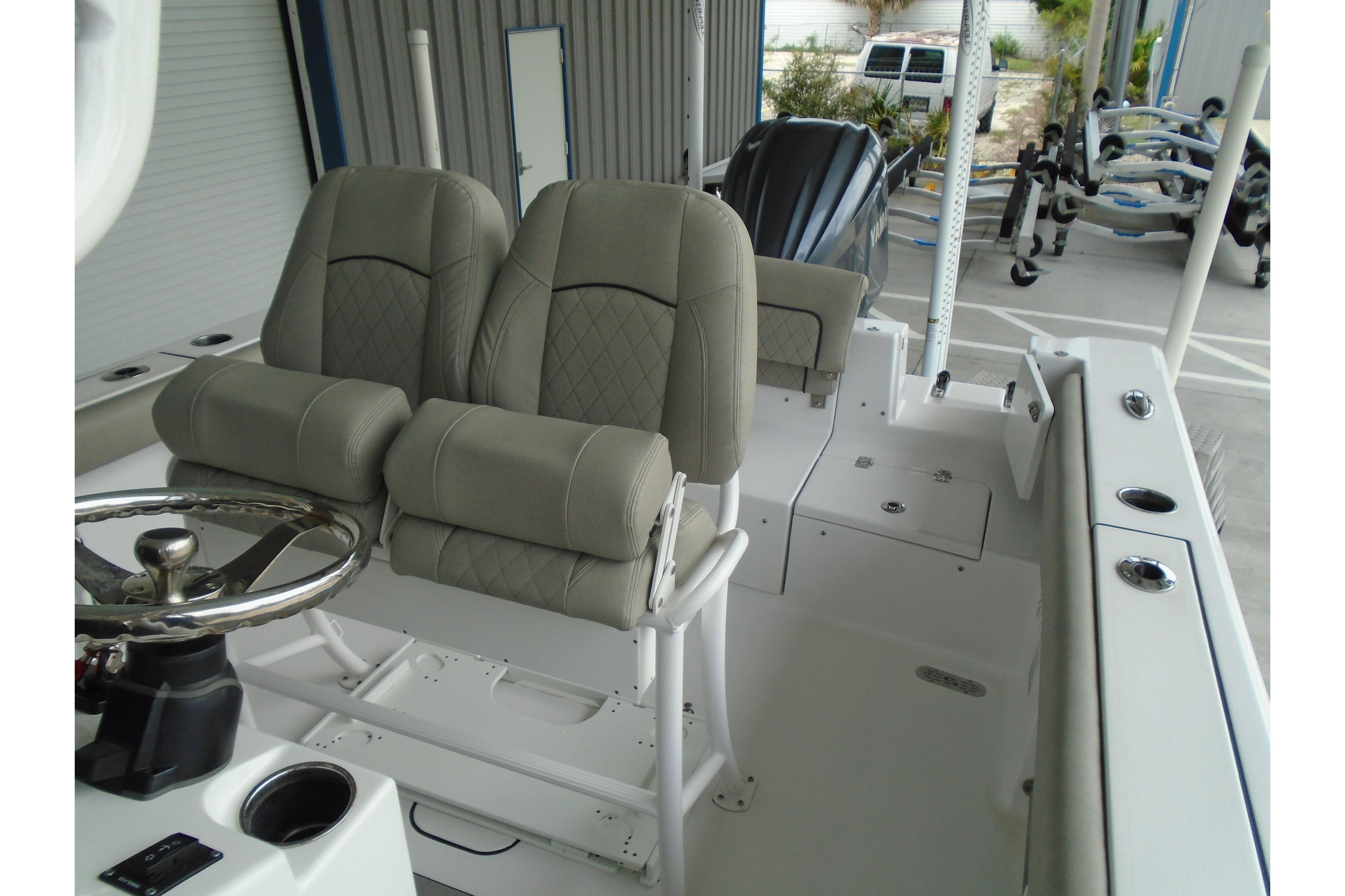 2022 Sportsman Heritage 241 Center Console boat interior with dual seats and steering wheel.