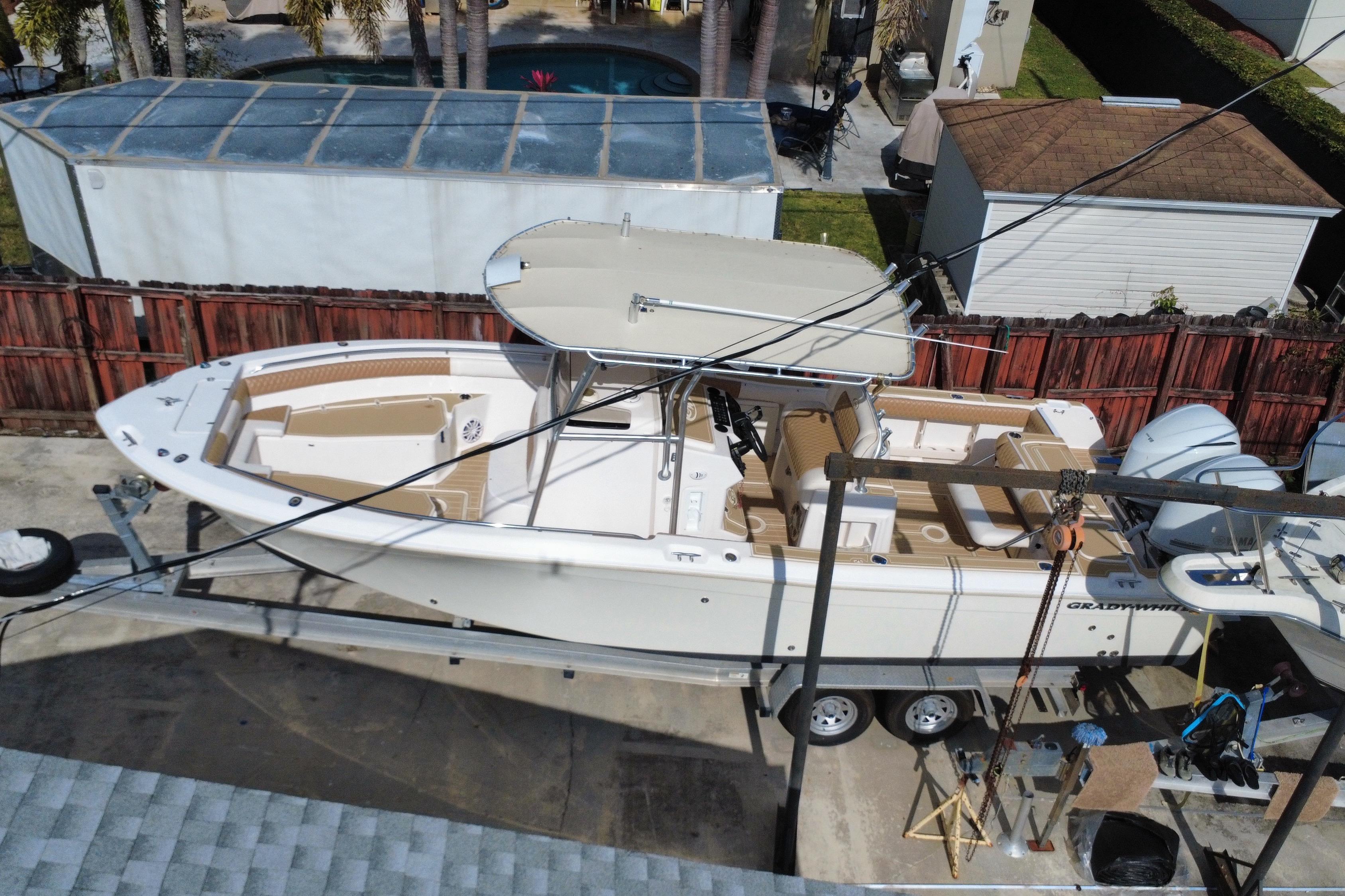 2004 Grady-White Canyon 283 boat on trailer, aerial view, parked in residential area.