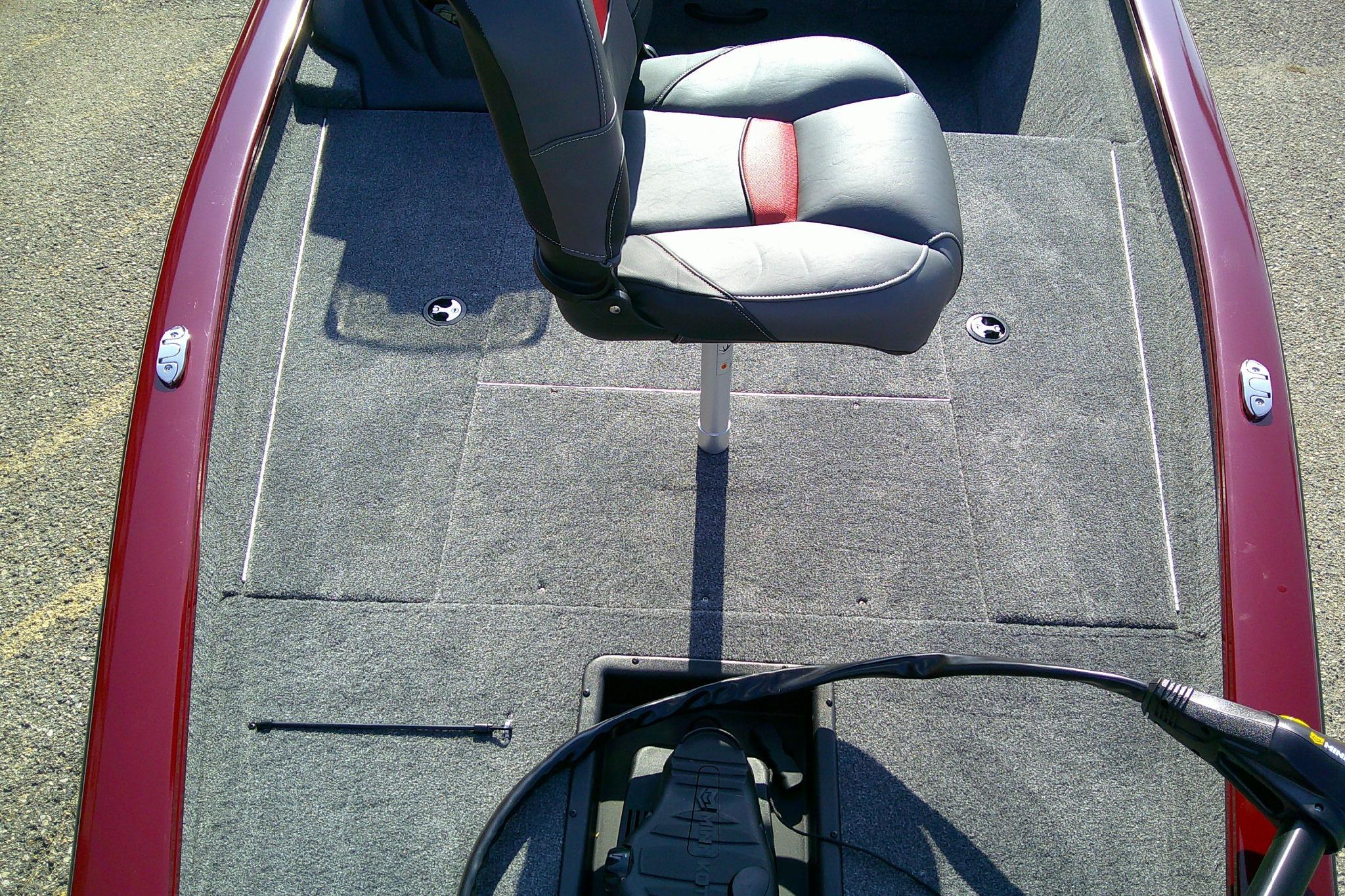2025 Tracker Pro Team 175 boat interior with gray carpet and swivel seat.