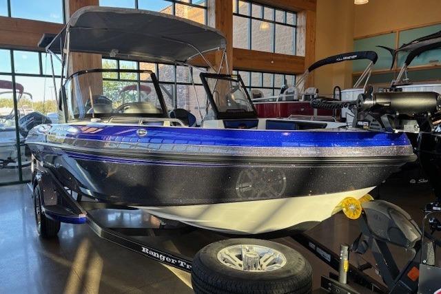 2026 Ranger 1850MS boat displayed indoors with blue and black exterior.
