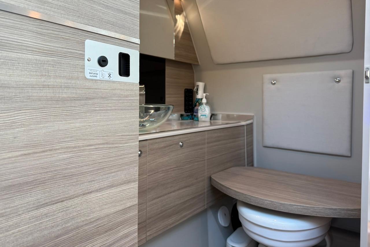 2024 Saxdor 320 GTC interior bathroom with modern wood finish and compact design.