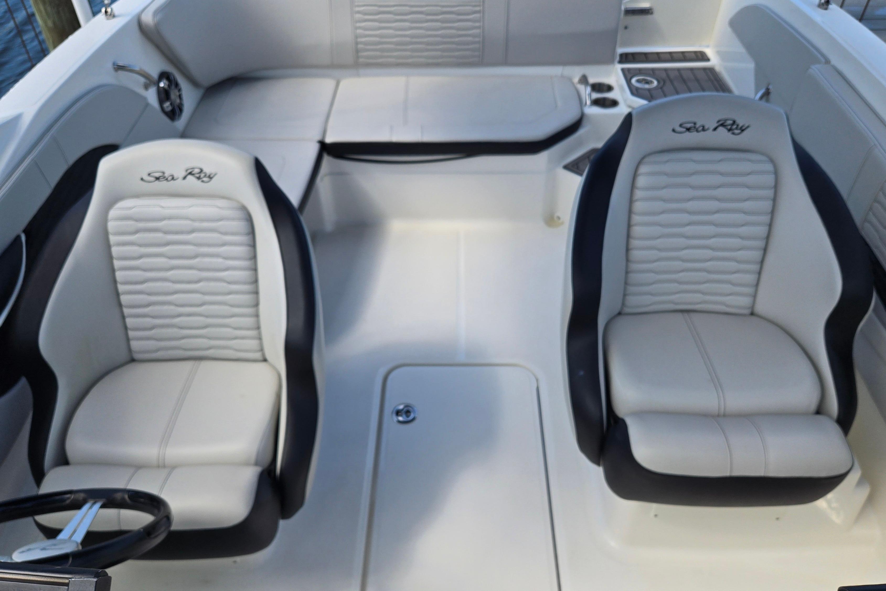 2023 Sea Ray SPX 210 boat interior with two plush seats and sleek design.