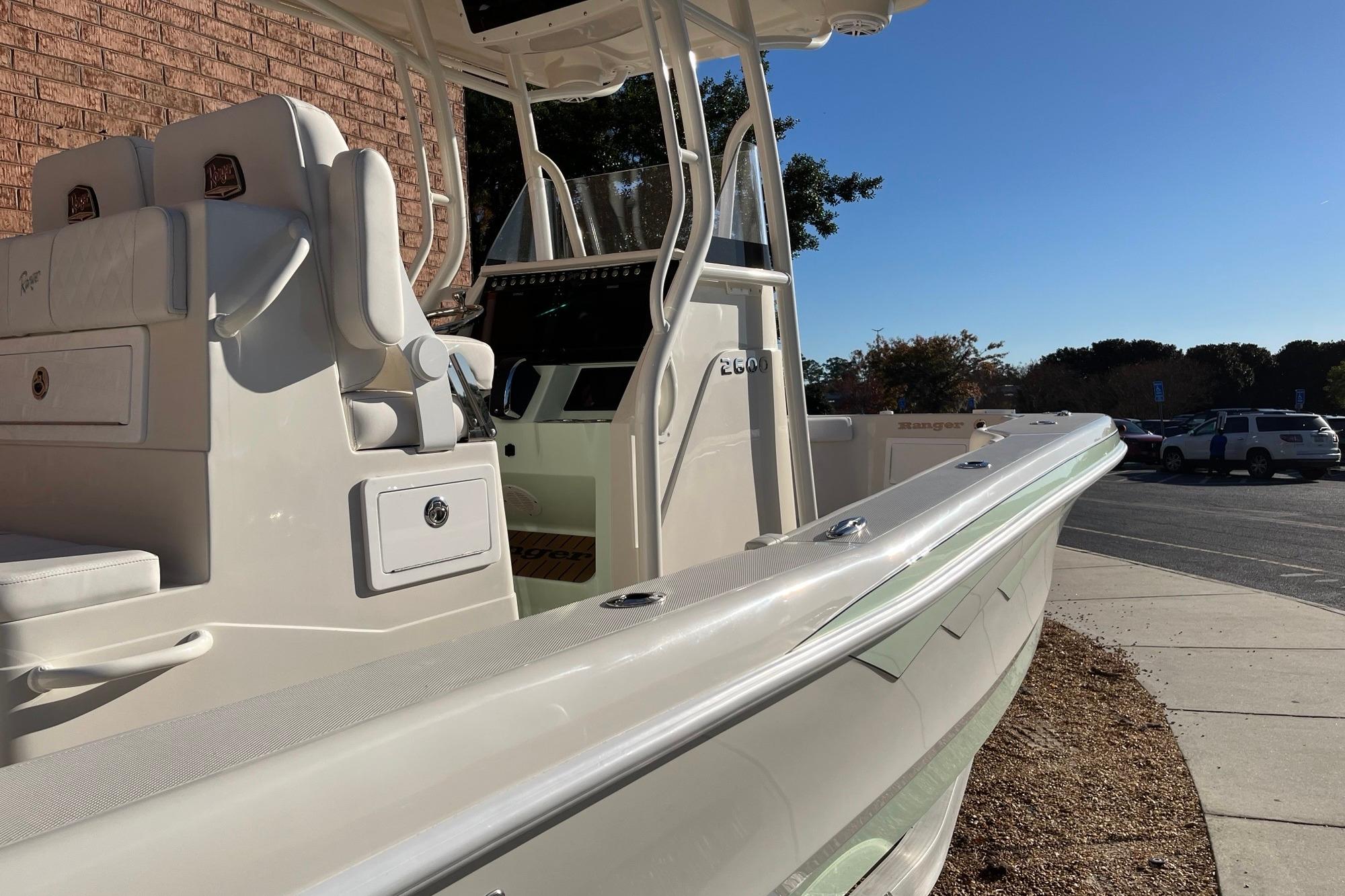 2024 Ranger 2600 Bay boat with sleek design and modern features, parked outdoors.