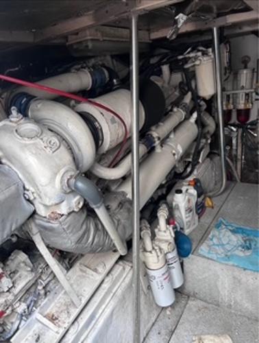 Engine room of 1986 Egg Harbor 60 Sportfisherman with visible machinery and equipment.