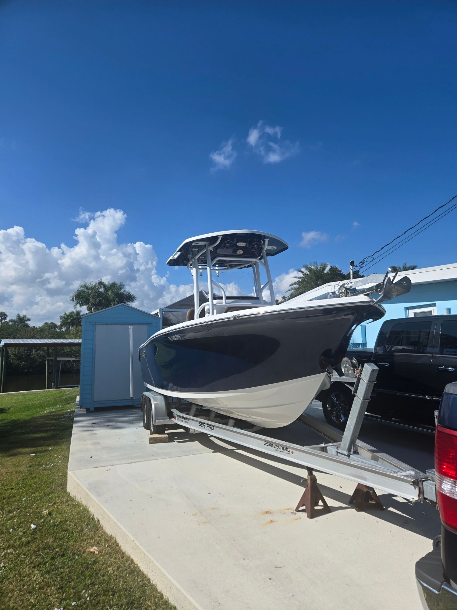 2018 Sea Pro 21.9 boat on trailer parked outdoors.