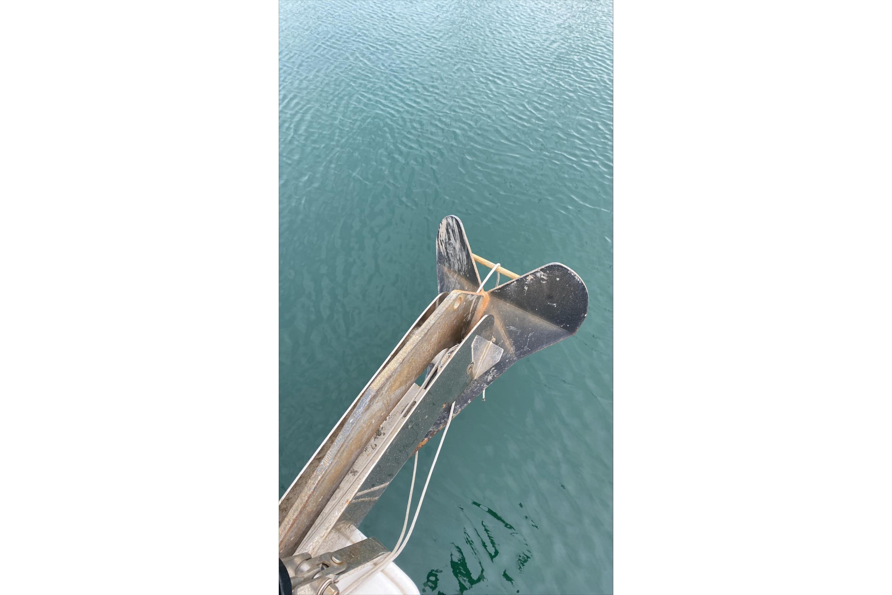 Anchor of 2020 Beneteau Oceanis 41.1 yacht over calm water.