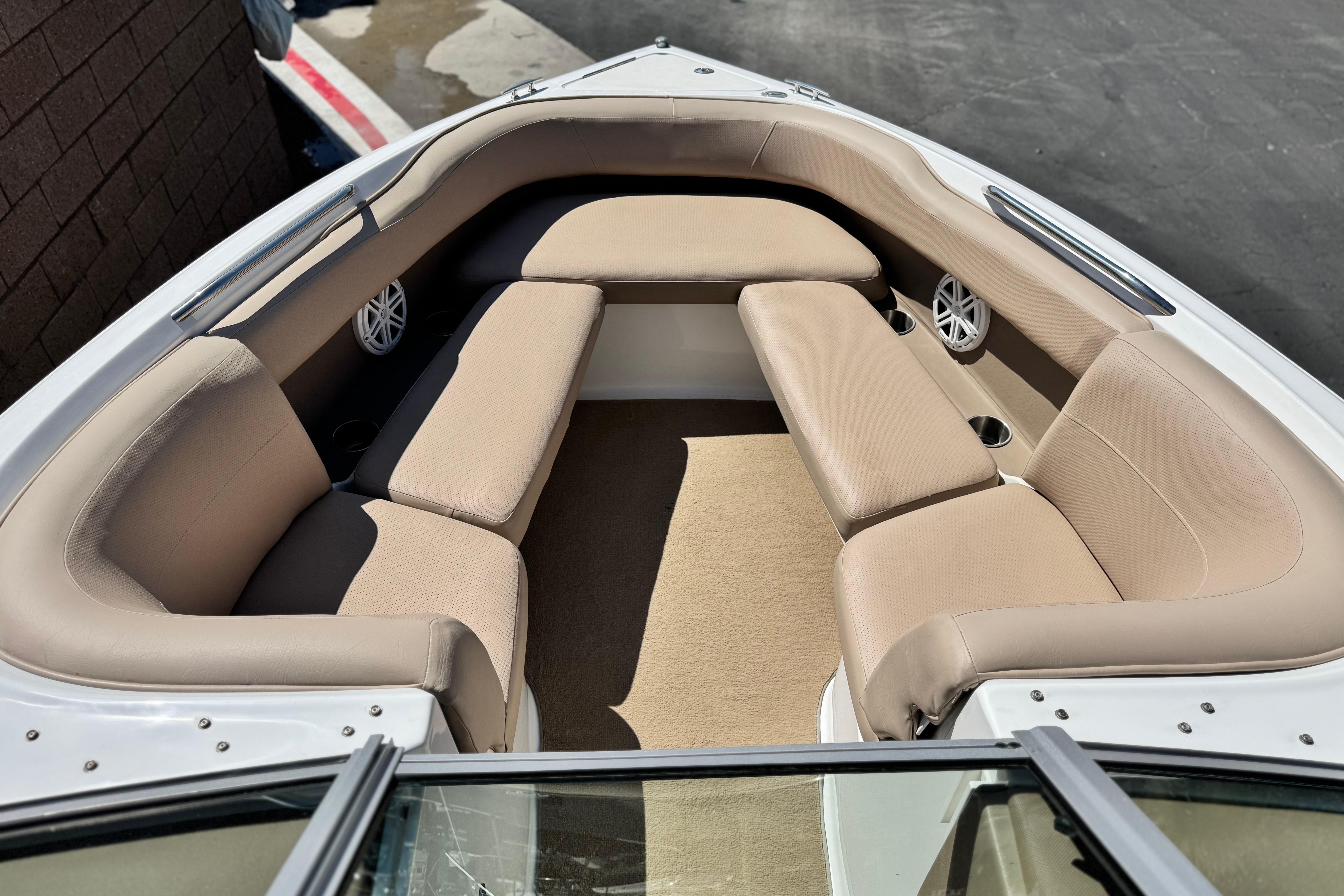Interior of a 2008 Cobalt 262 boat with beige seating and speakers.