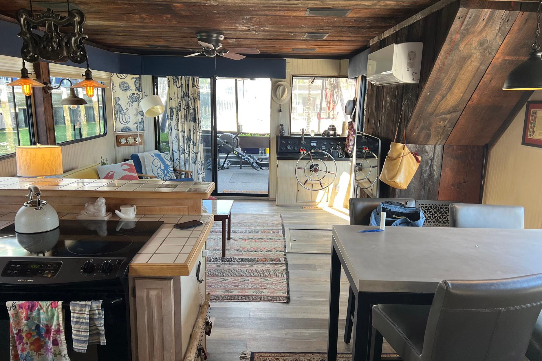 Interior of a 1993 Sumerset houseboat with rustic decor and modern amenities.