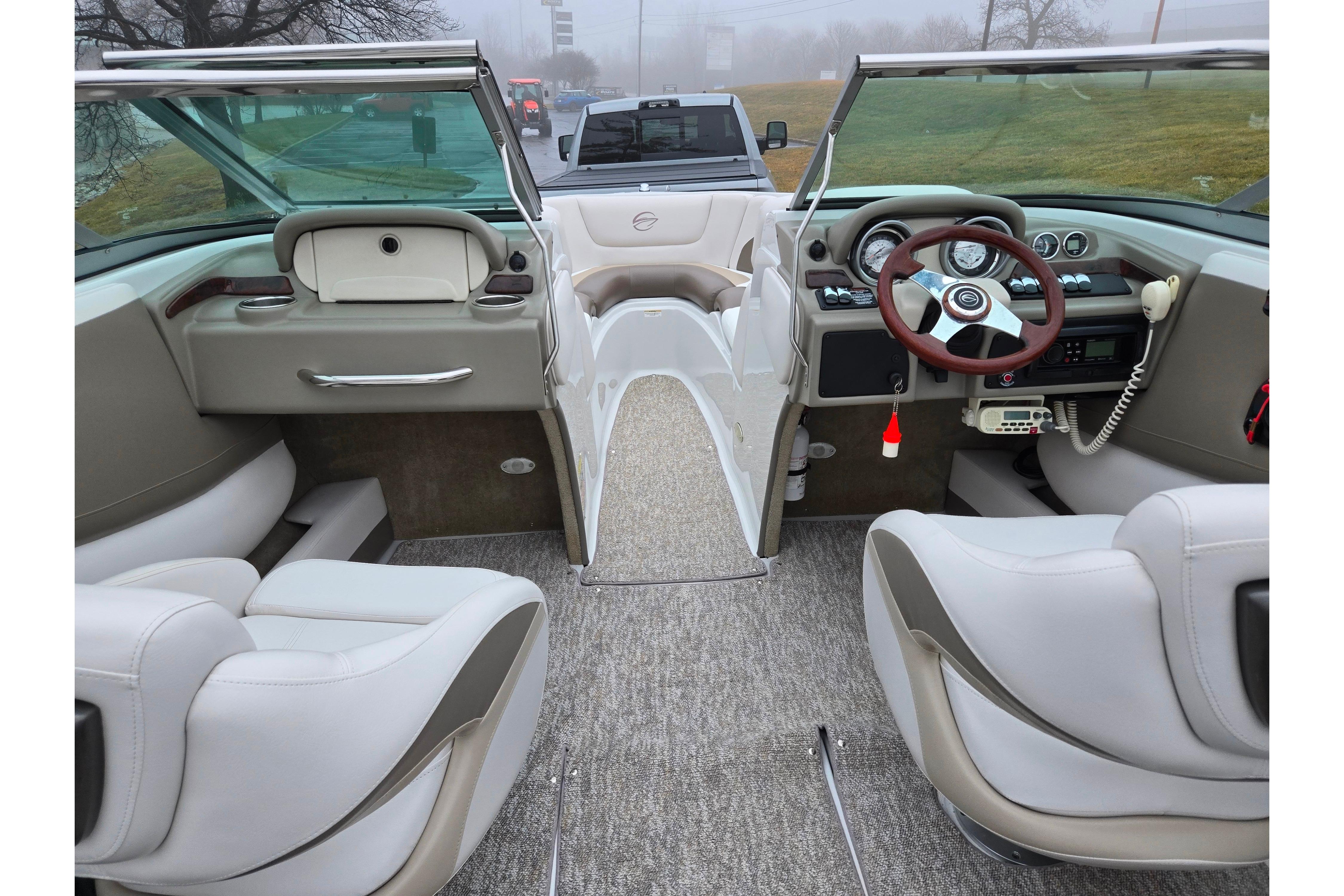 Interior view of 2012 Crownline 235 SS boat with modern dashboard and seating.