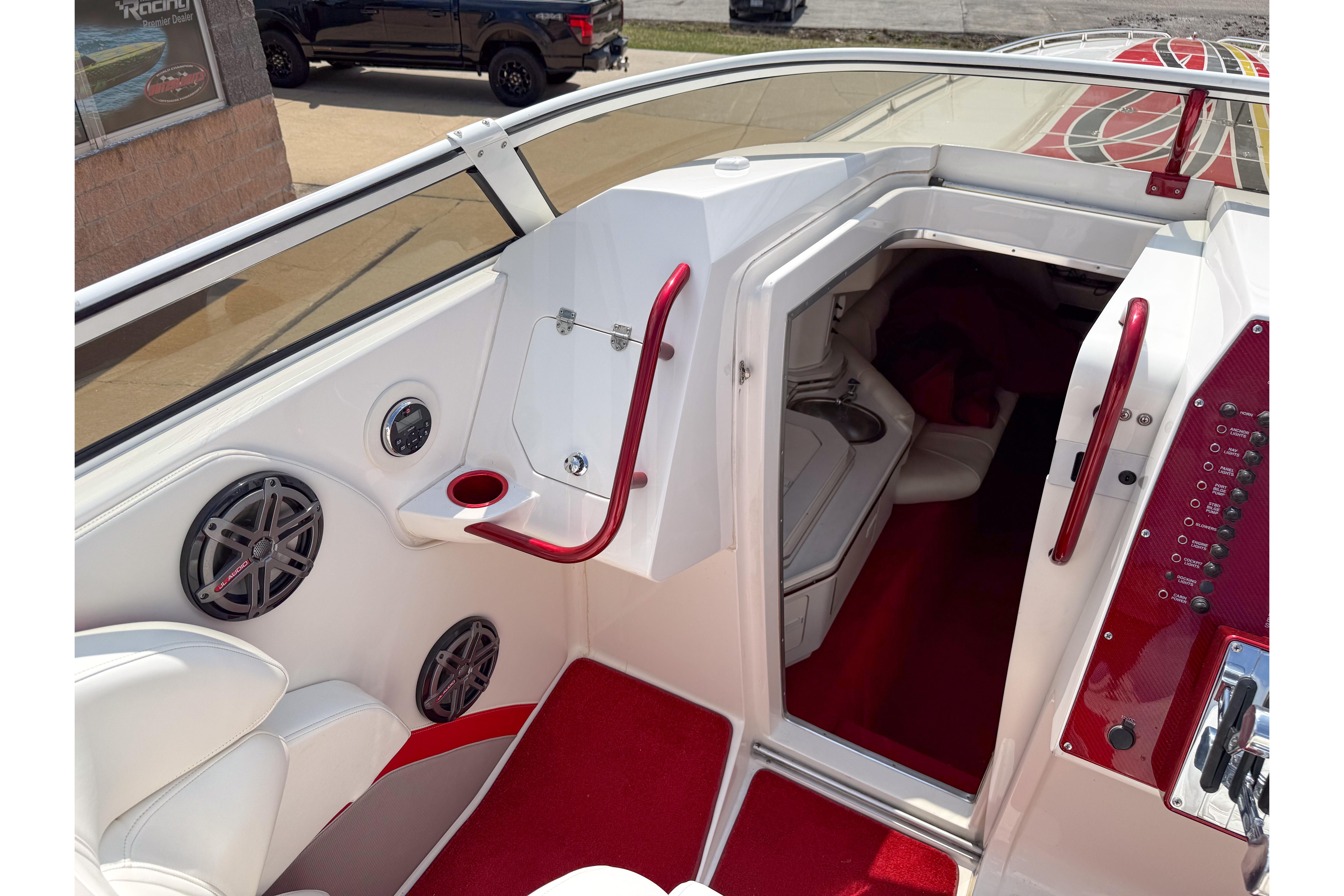 Interior of 2007 Fountain 42 Lightning boat with red accents and seating area.