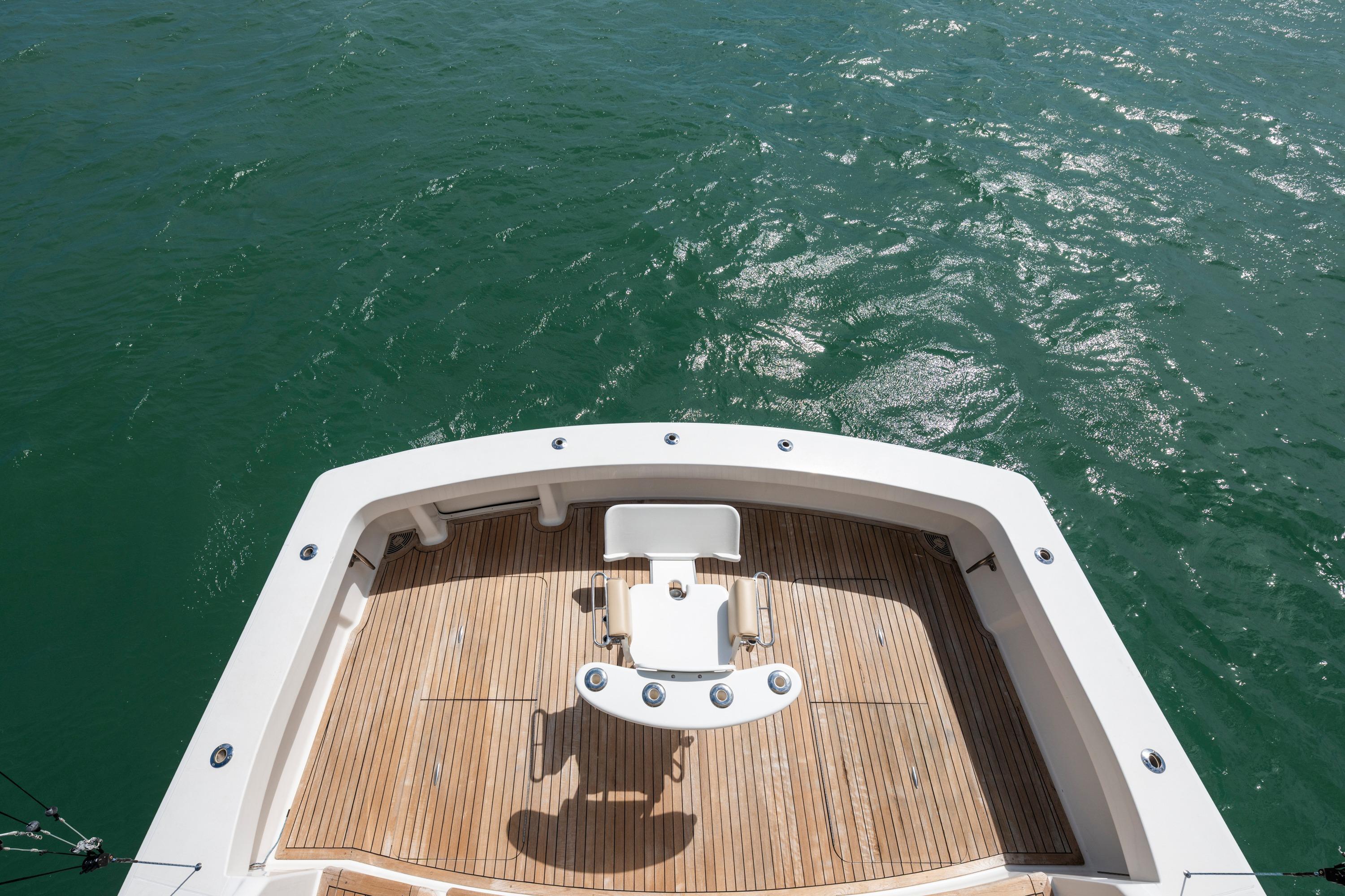 2009 Viking 50 Convertible yacht deck overlooking calm green waters.