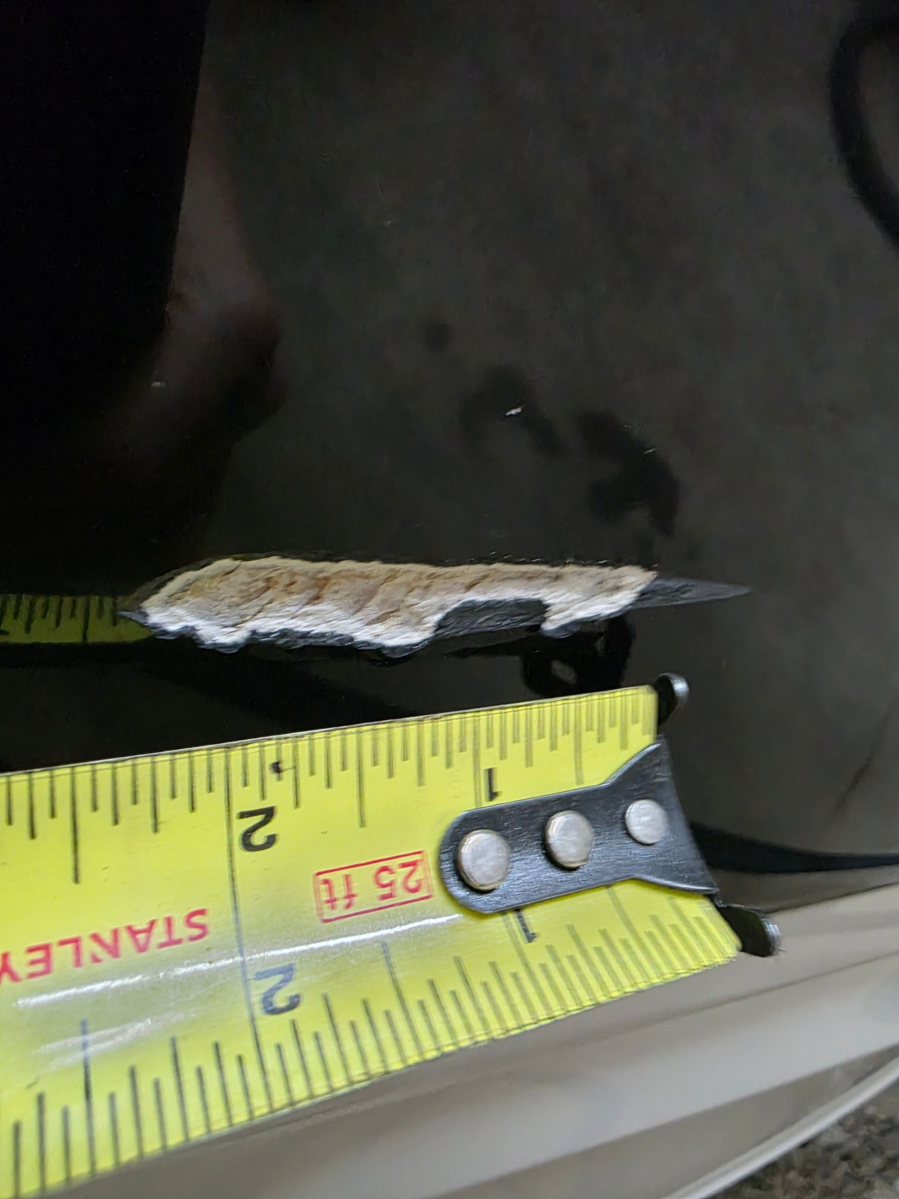 Close-up of damaged boat with measuring tape, Monterey 228SI Montura Bowrider 2004.