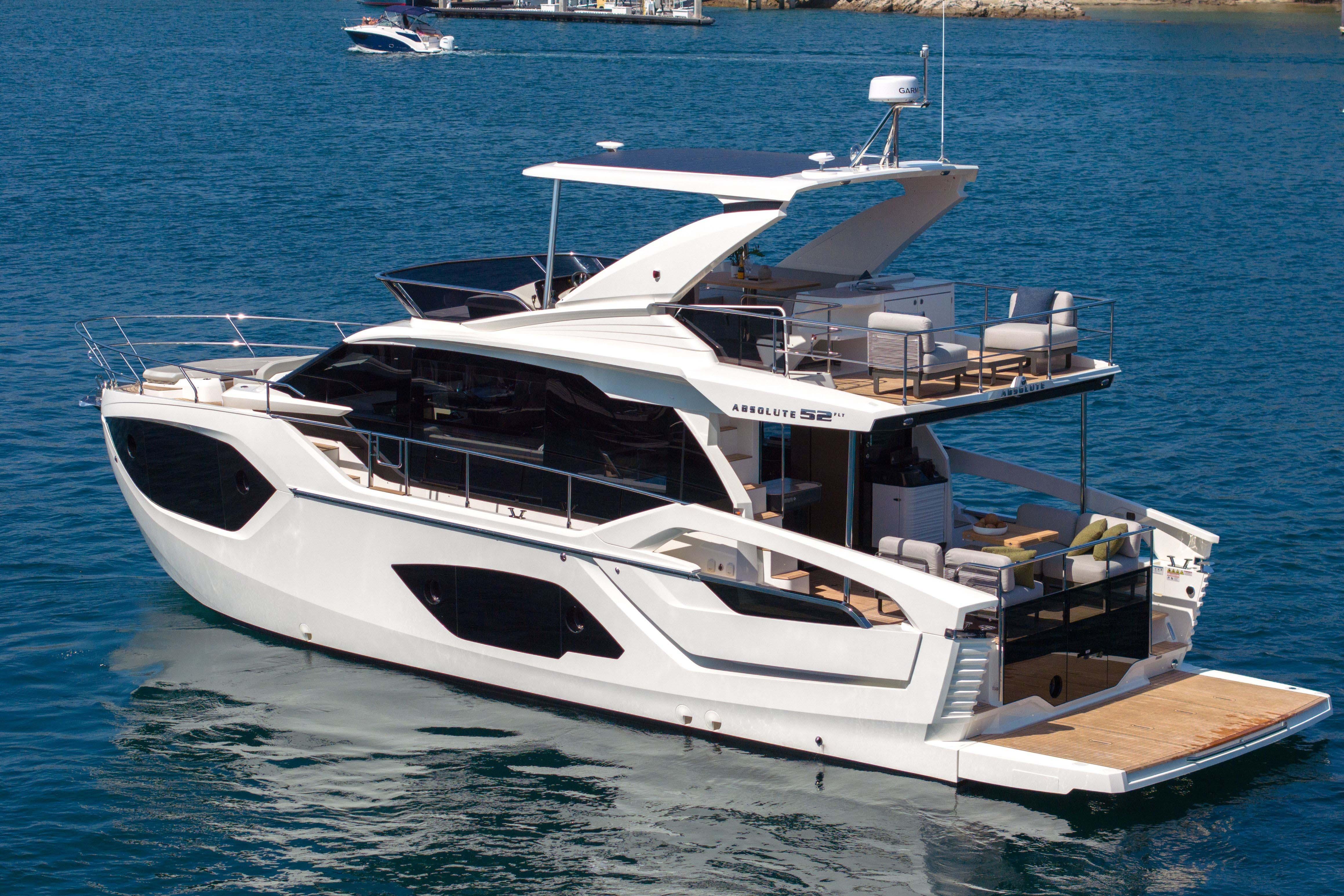 Luxury Absolute 52 Fly yacht, 2026 model, cruising on serene blue waters.