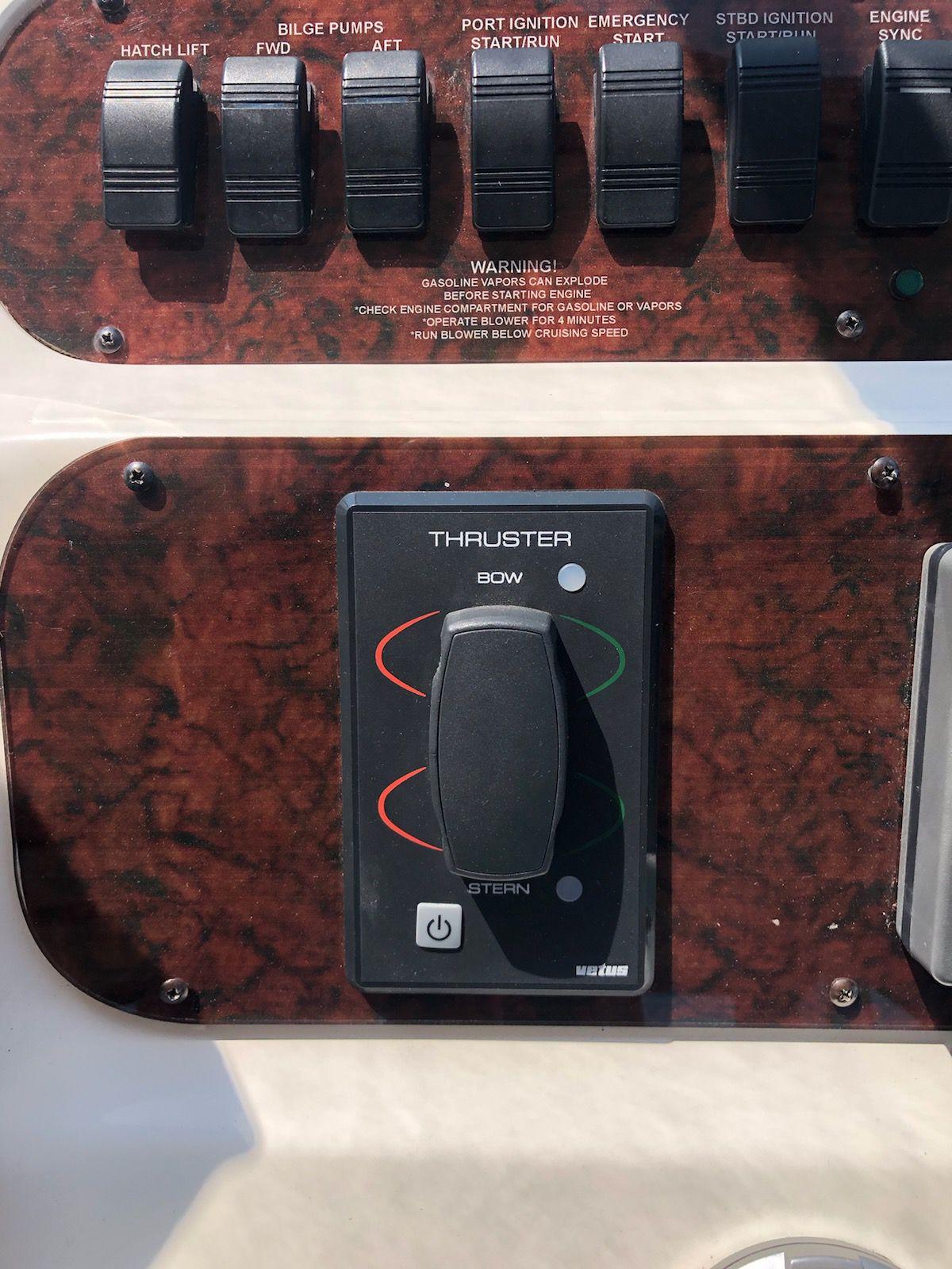 Control panel of a 1997 Sea Ray 400 Sundancer boat with thruster switch.