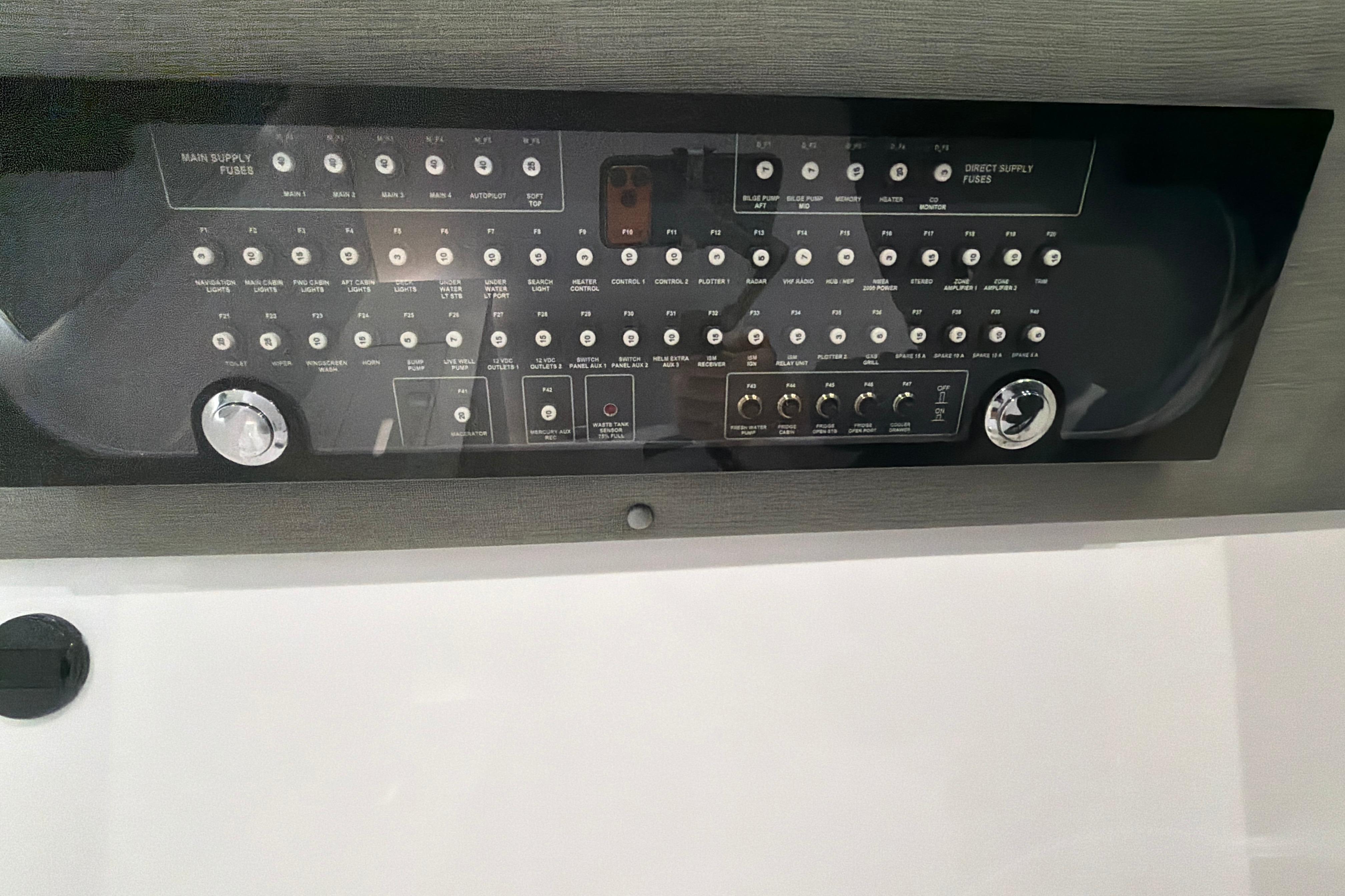 Control panel of 2022 Axopar Brabus 37 XC Cross Cabin boat, featuring various switches and dials.