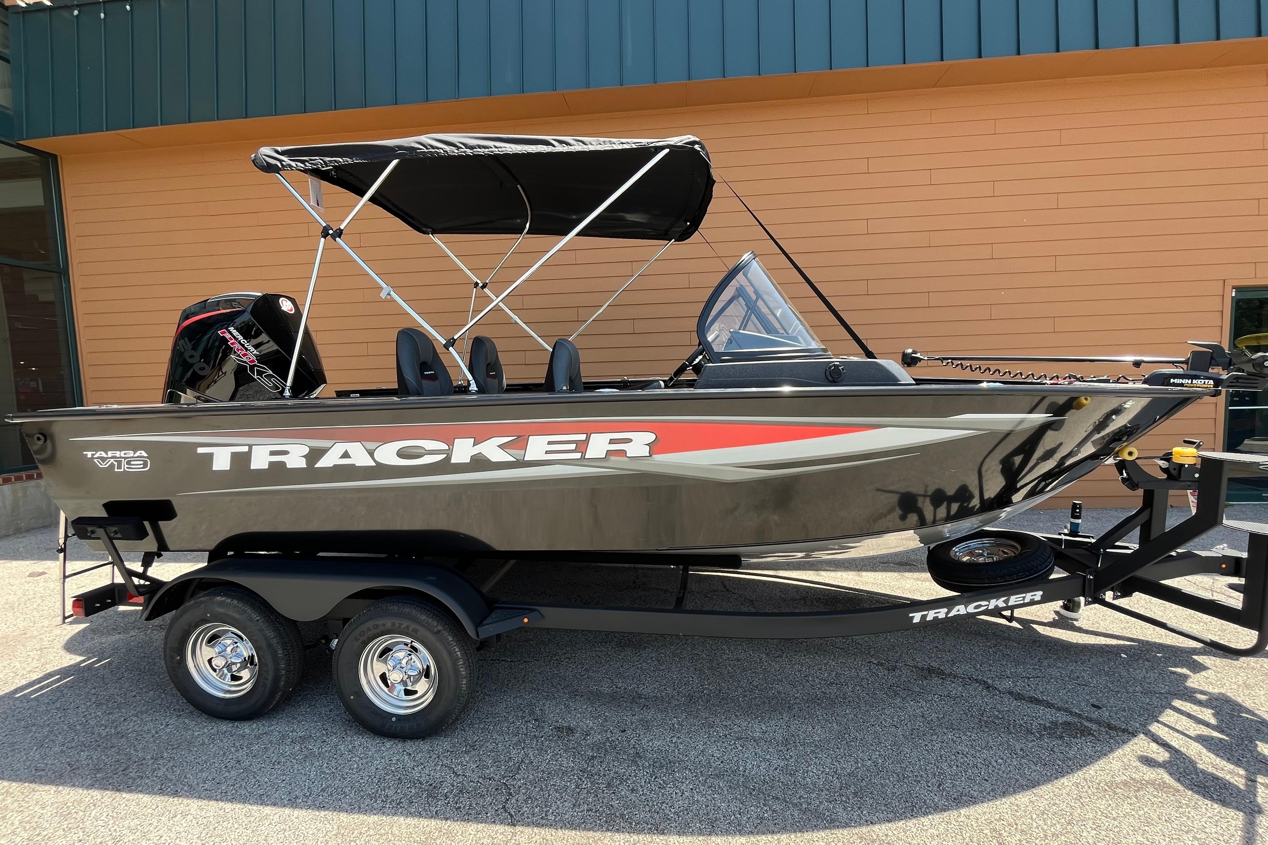 2026 Tracker Targa V-19 Combo boat on trailer, parked outdoors.