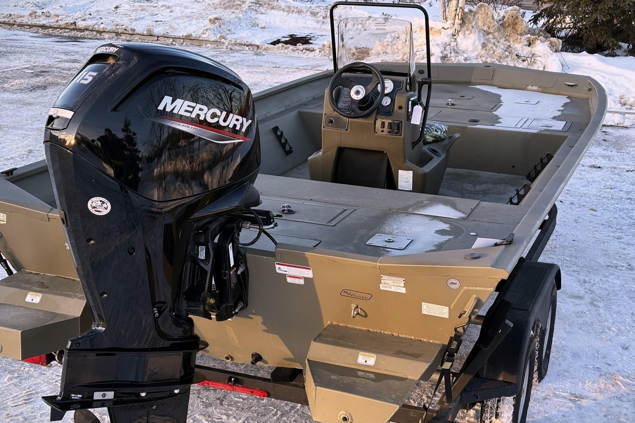 2024 Tracker Grizzly 2072 CC boat with Mercury engine in snow.